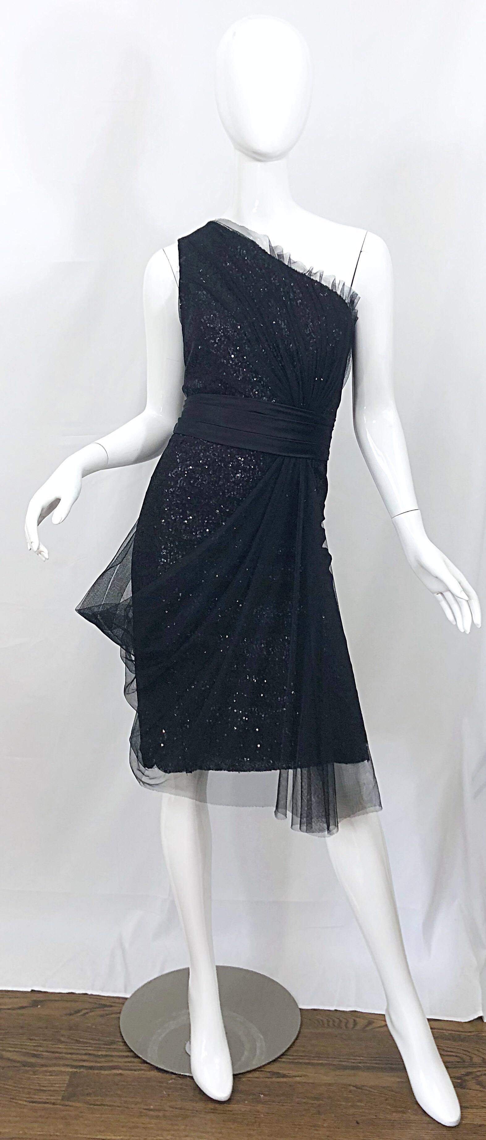 Beautiful vintage 1990s LIANCARLO COUTURE black silk sequined one shoulder dress! Features a black silk backdrop, with thousands of black hand-sewn sequins throughout. Layers of mesh add just the right of detail to this little black dress. Hidden