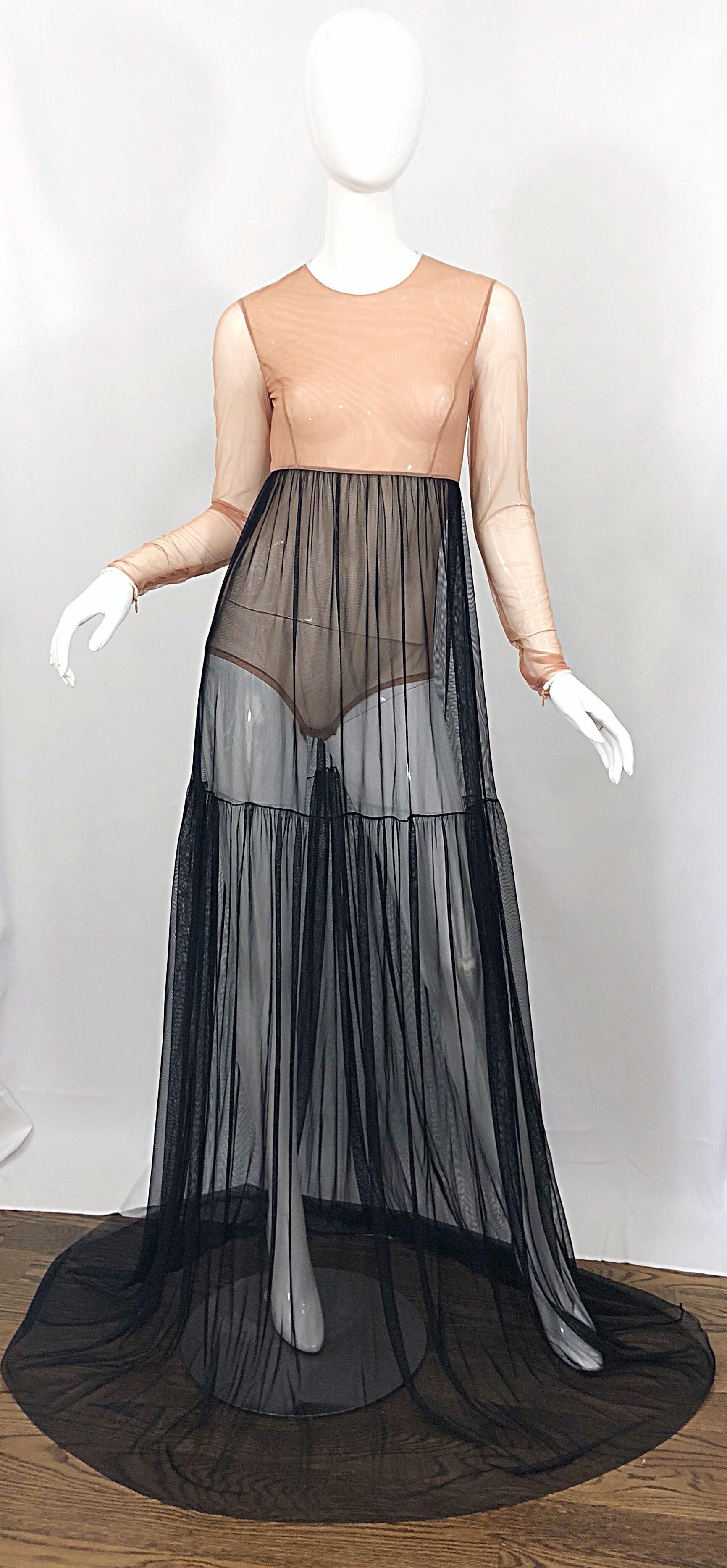 Sexy MICHAEL KORS COLLECTION nude and black sheer bodysuit gown! Features an attached nude bodysuit, with a black high waisted mesh skirt. White trim at neck and sleeves. Hidden zipper at each sleeve cuff. Extra long train adds a dramatic effect,