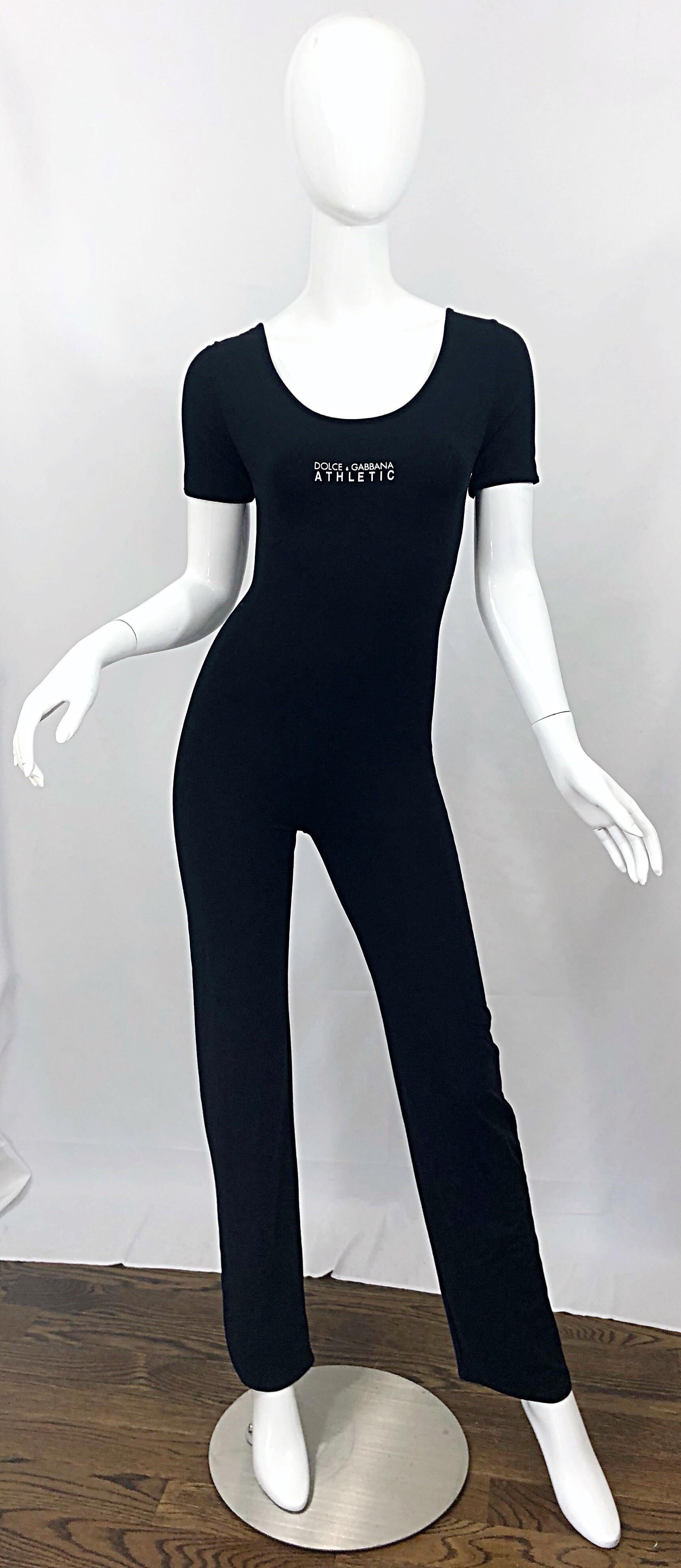 Awesome never worn late 1990s DOLCE & GABBANA logo black and white 'Athletic' short sleeve jumpsuit! Fitted bodice with slim legs and a slight bootcut fit. Super soft lightweight stretchy fabric make this perfect for the gym or a night out (75%