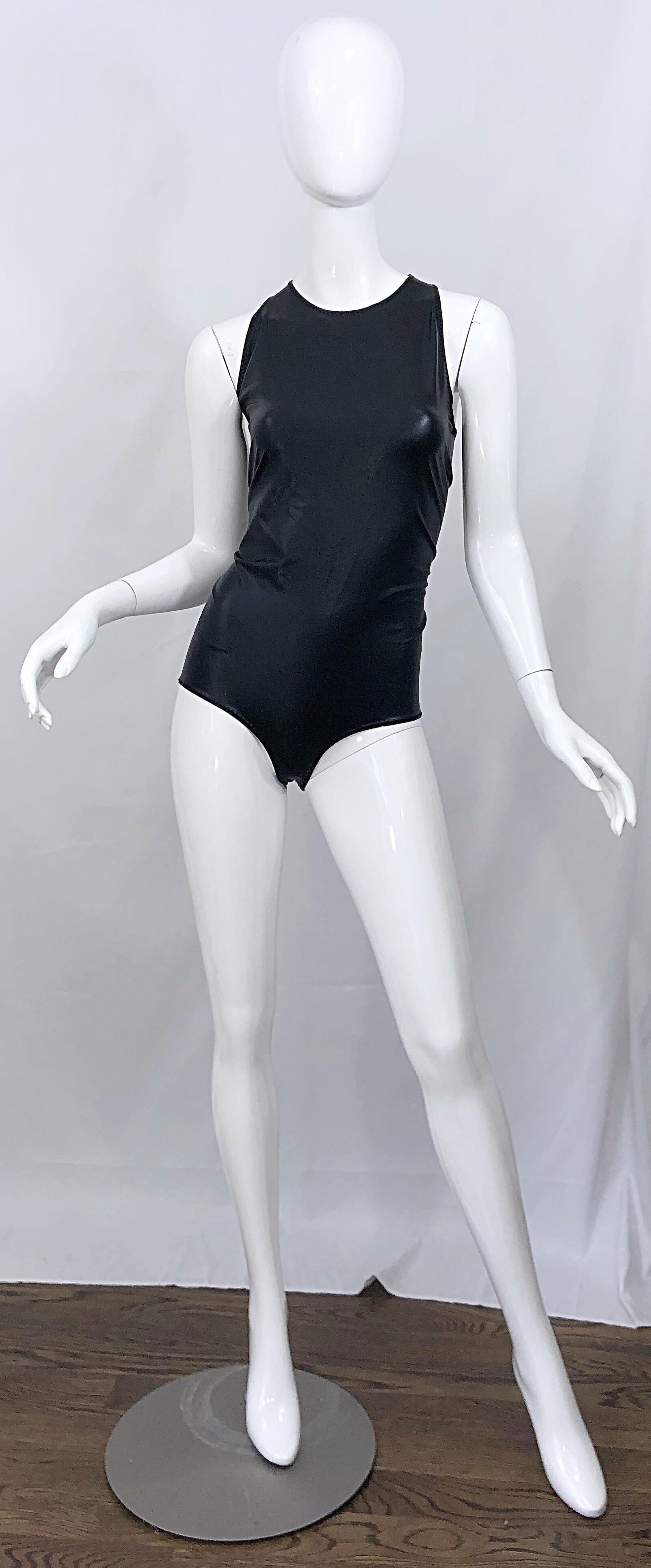 Sexy never worn vintage 90s BOTTEGA VENETA black pleather dominatrix fetish one piece bodysuit! Features a flatter very stretchy black pleather. Hidden zipper up the back. Extremely well made, with every detail perfectly finalized. Great with jeans,