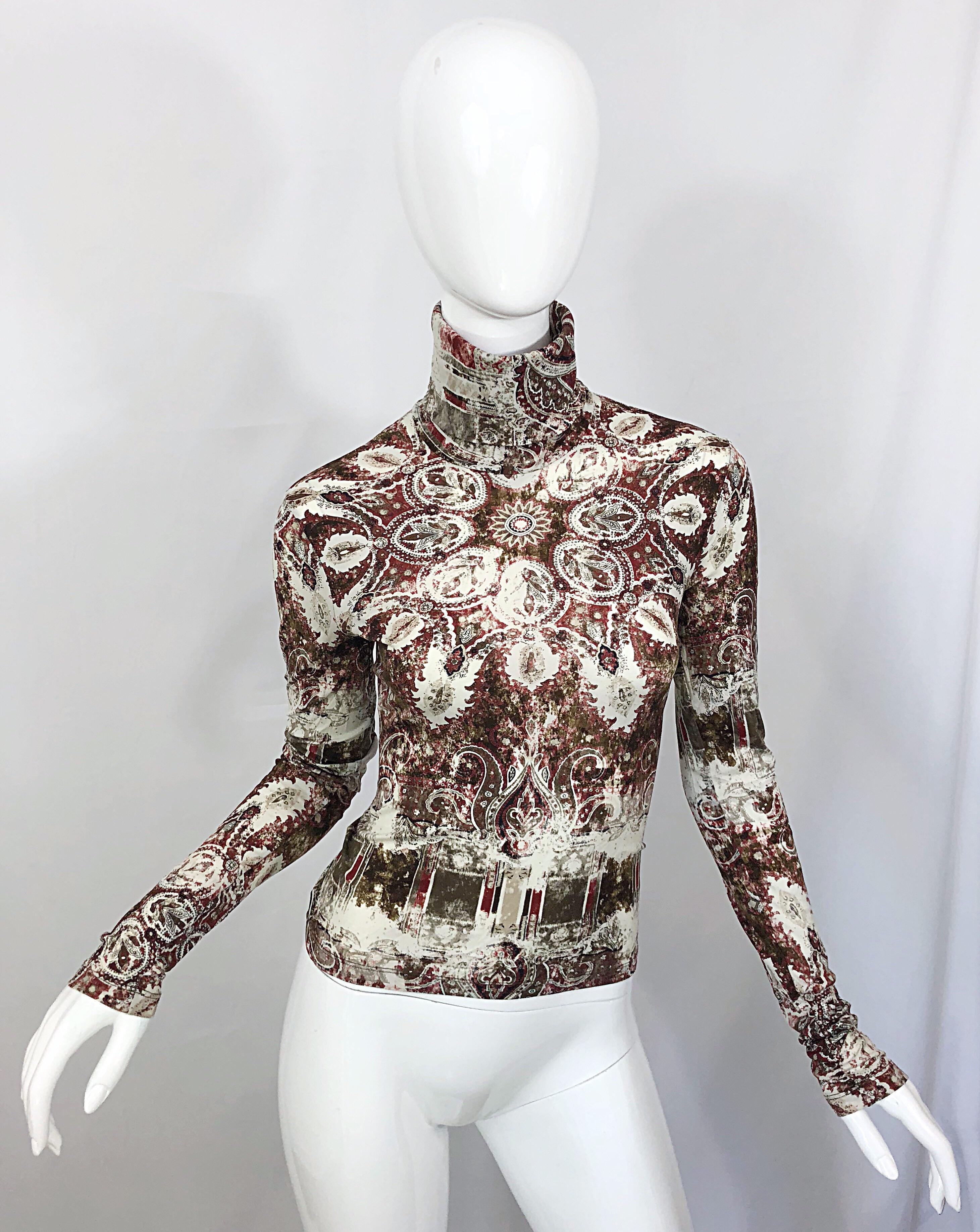 Amazing vintage late 90s JEAN PAUL GAULTIER distressed medallion paisley print turtleneck shirt! Features warm hues of red, forest green, brown, taupe and white throughout. Super soft classic Gaultier Nylon jersey stretches to fit. Can easily be