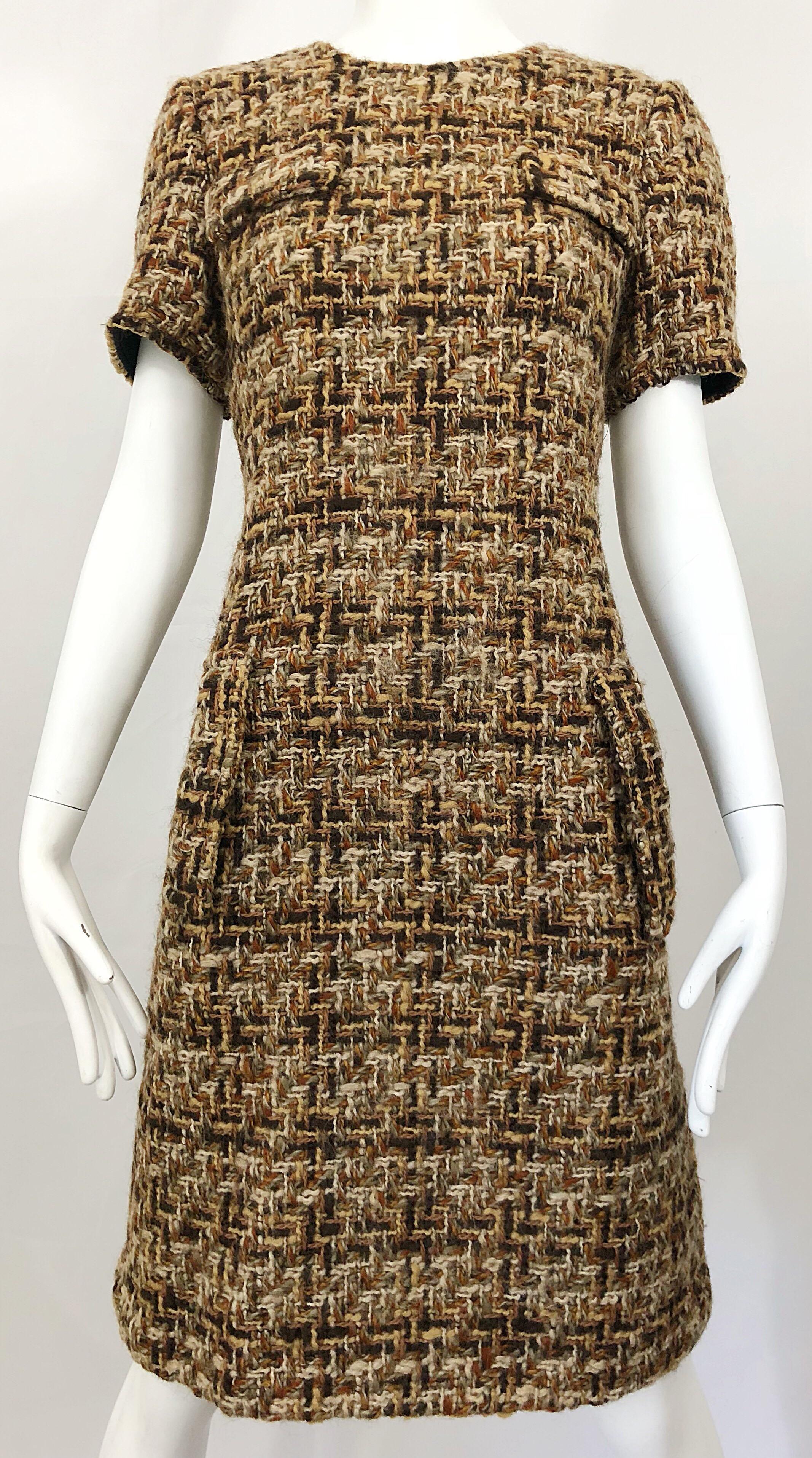 Chic 1960s brown, taupe, rust, ivory and black short sleeve wool boucle shift dress! Features super soft woven wool boucle. Fitted bodice with a forgiving slightly flared skirt. POCKETS at each side of the waist. Full metal zipper up the back with