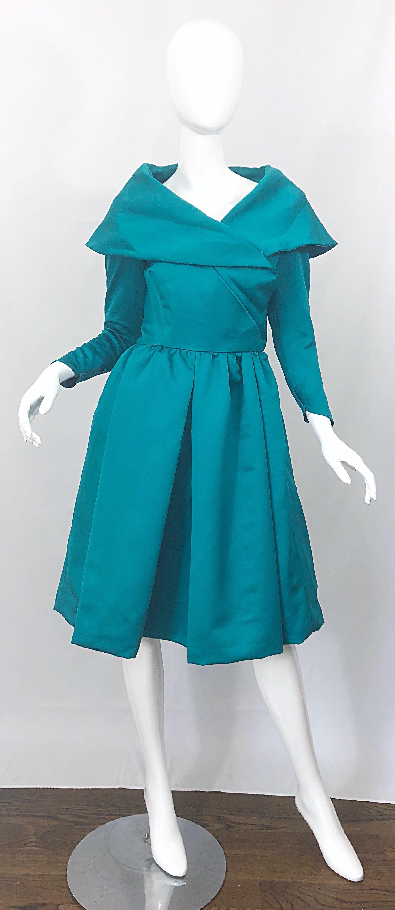 Beautiful vintage VICTOR COSTA teal green / blue satin fit n' flare long sleeve cocktail dress! Features an elegant collar with a fitted bodice and tulip shaped sleeve cuff that has hidden snaps. Wrap style with several hidden snaps and hook-and-eye