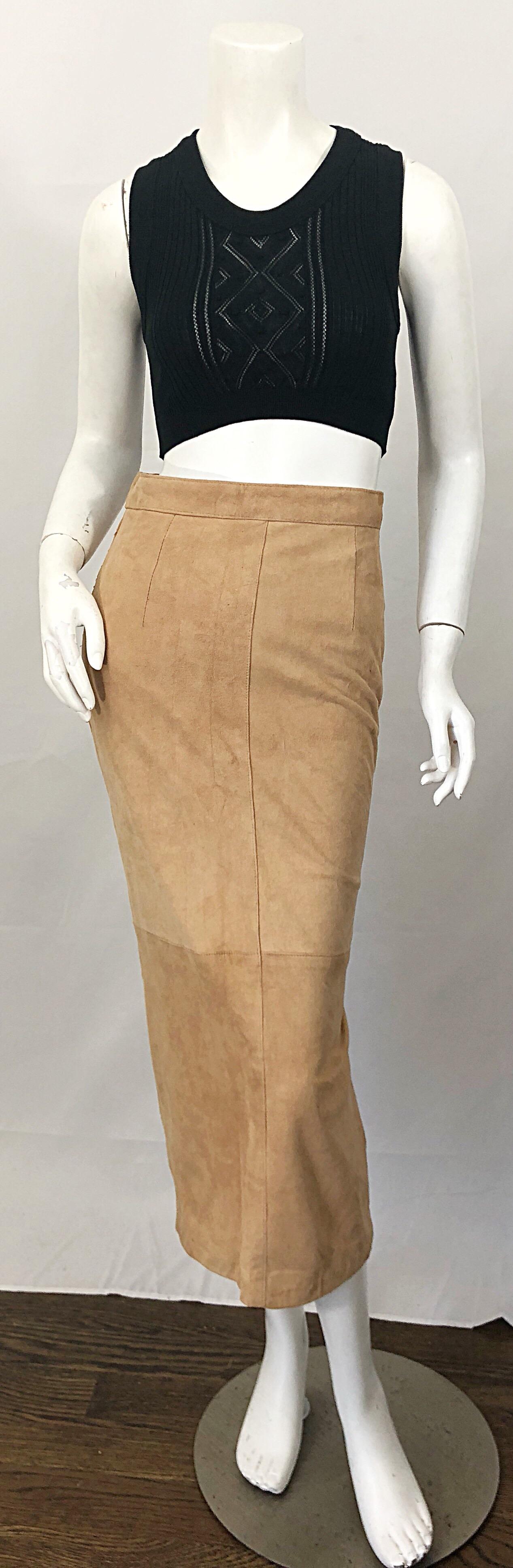 Chic early 90s CALVIN KLEIN high waisted vintage tan suede leather midi pencil skirt! Flattering high waist with a sleek tailored fit. Fully lined. Hidden zipper up the back with button closure. Can easily be dressed up or down. The pictured vintage