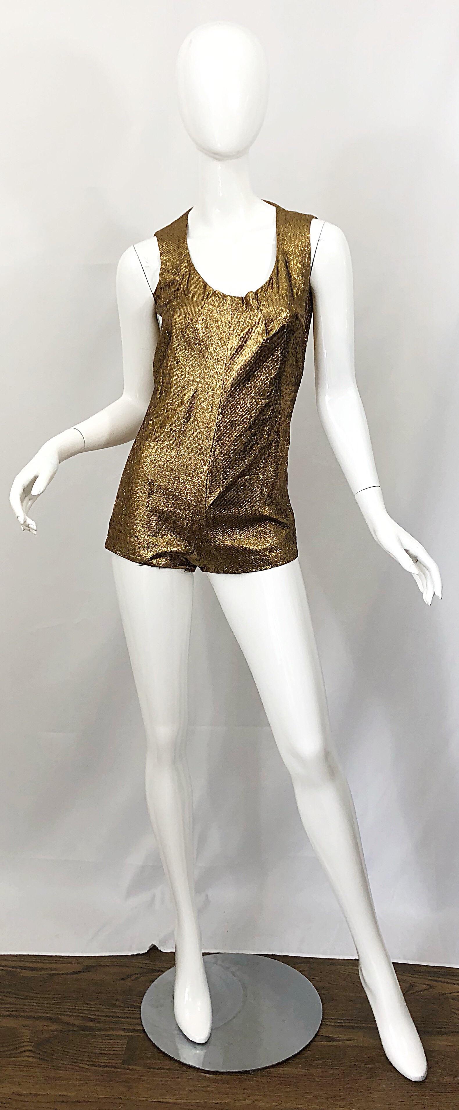 Amazing 1970s gold lurex disco one piece romper and swing cape! Wonderful design with so much attention to detail. Lined in a beautiful yellow silk. Hidden zipper up the back with hook-and-eye closure. Both pieces great together or as separates.