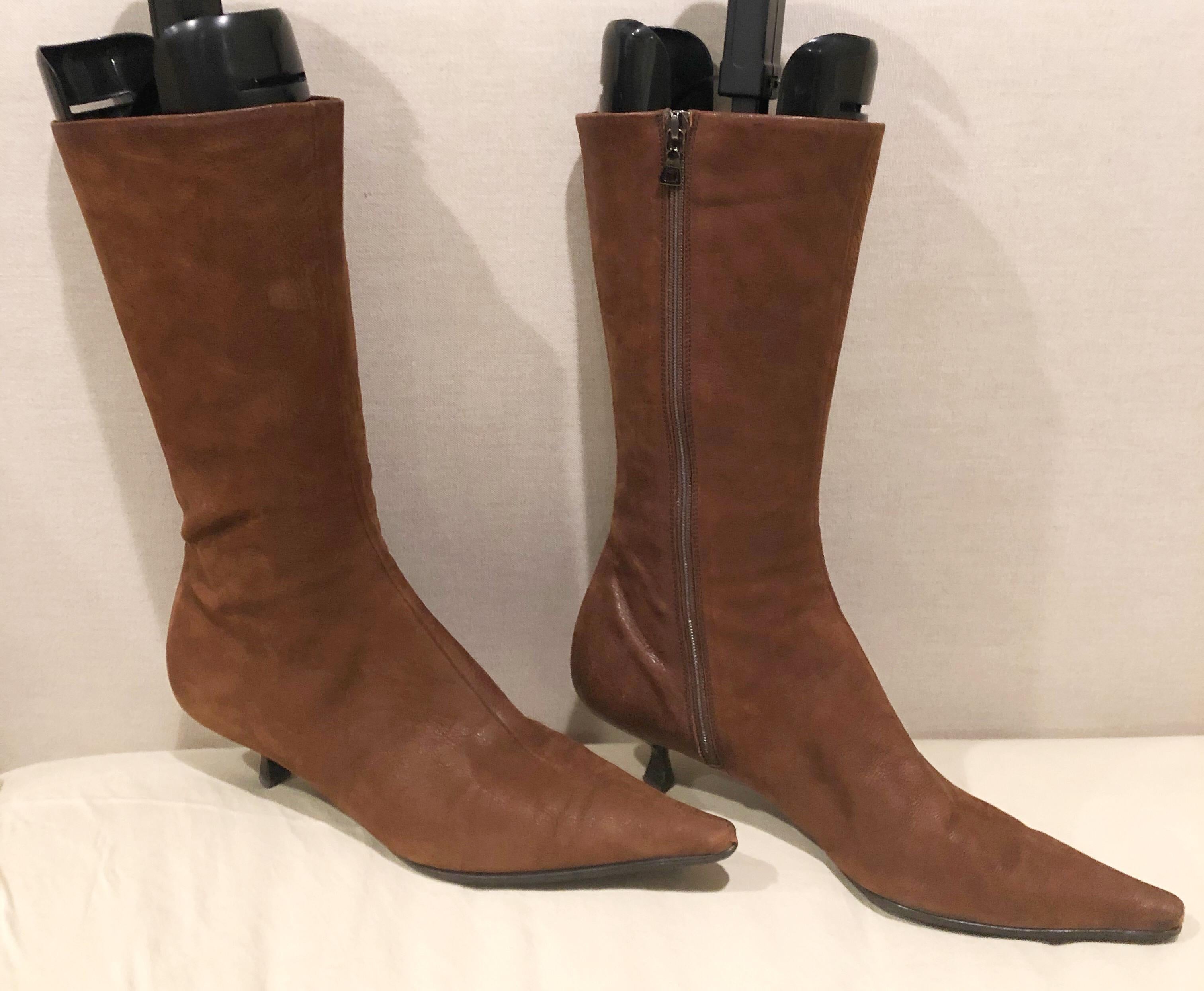 Stylish early 2000s PRADA Size 38.5 (US 8.5) medium brown mid calf kitten heel boot! The perfect length in between ankle boots and knee high boots! Zipper up the inner ankle. Leather soles with rubber protection to prevent slipping. Super