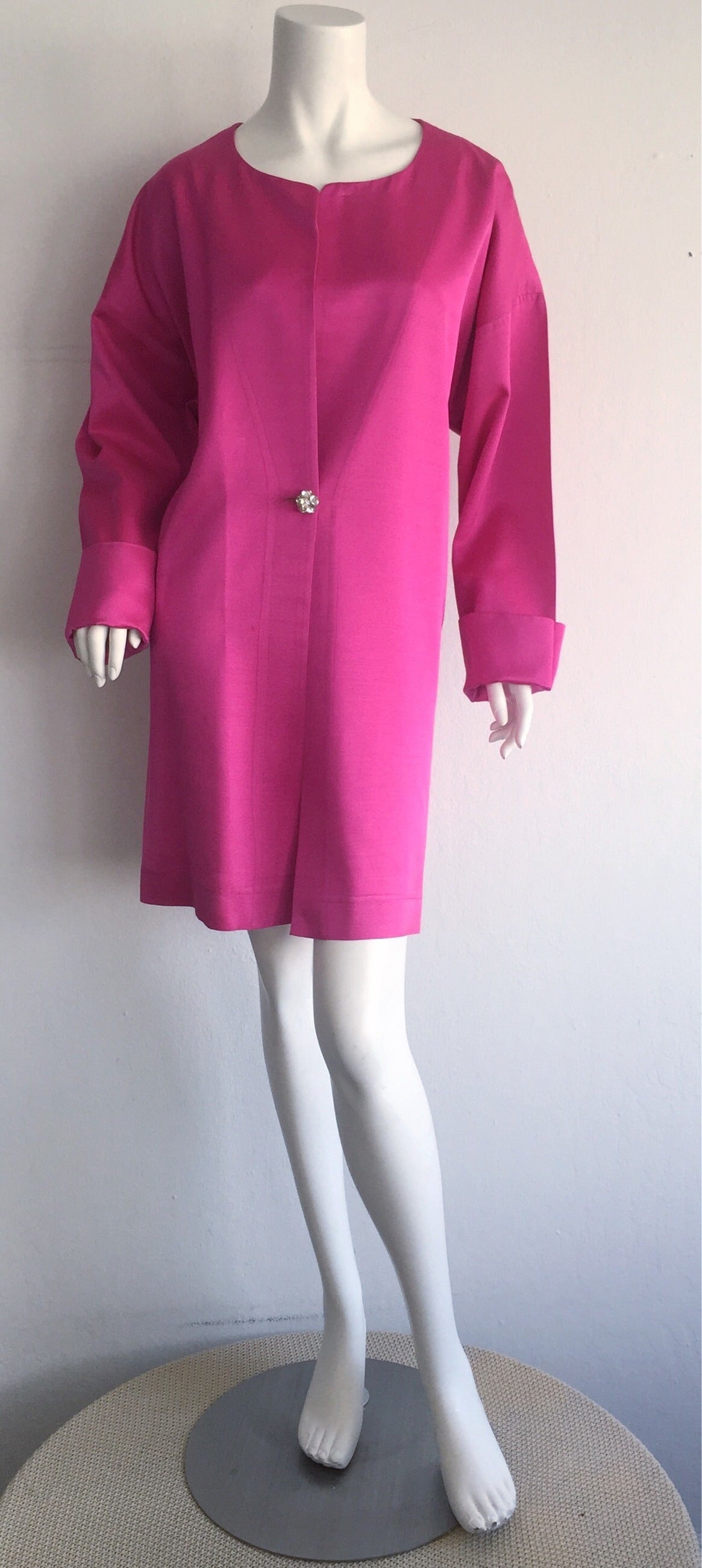 Insanely gorgeous vintage 1960s Jean Muir opera/swing jacket! Vibrant hue of pink/fuchsia. Features a single button closure of clustered rhinestones. In great condition. Will fit Size S-XL 

Measurements:
Up to 48 inch bust
Up to 44 inch waist
