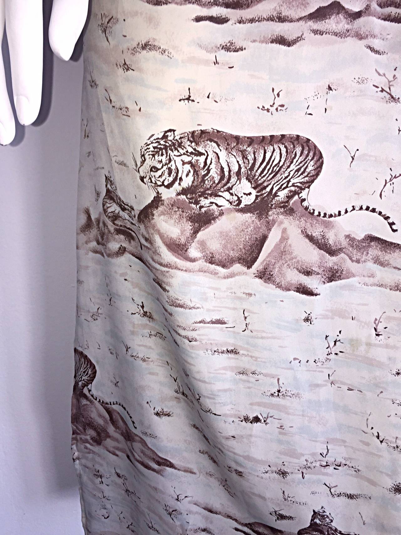 Amazing rare vintage Lanvin tunic/dress!!  Unique tiger print throughout. Ivory color, with brown/tan print. Functional buttons up the front, and two side slits at hem make for an easy versatile piece. Perfect for daytime, great over a swimsuit, or
