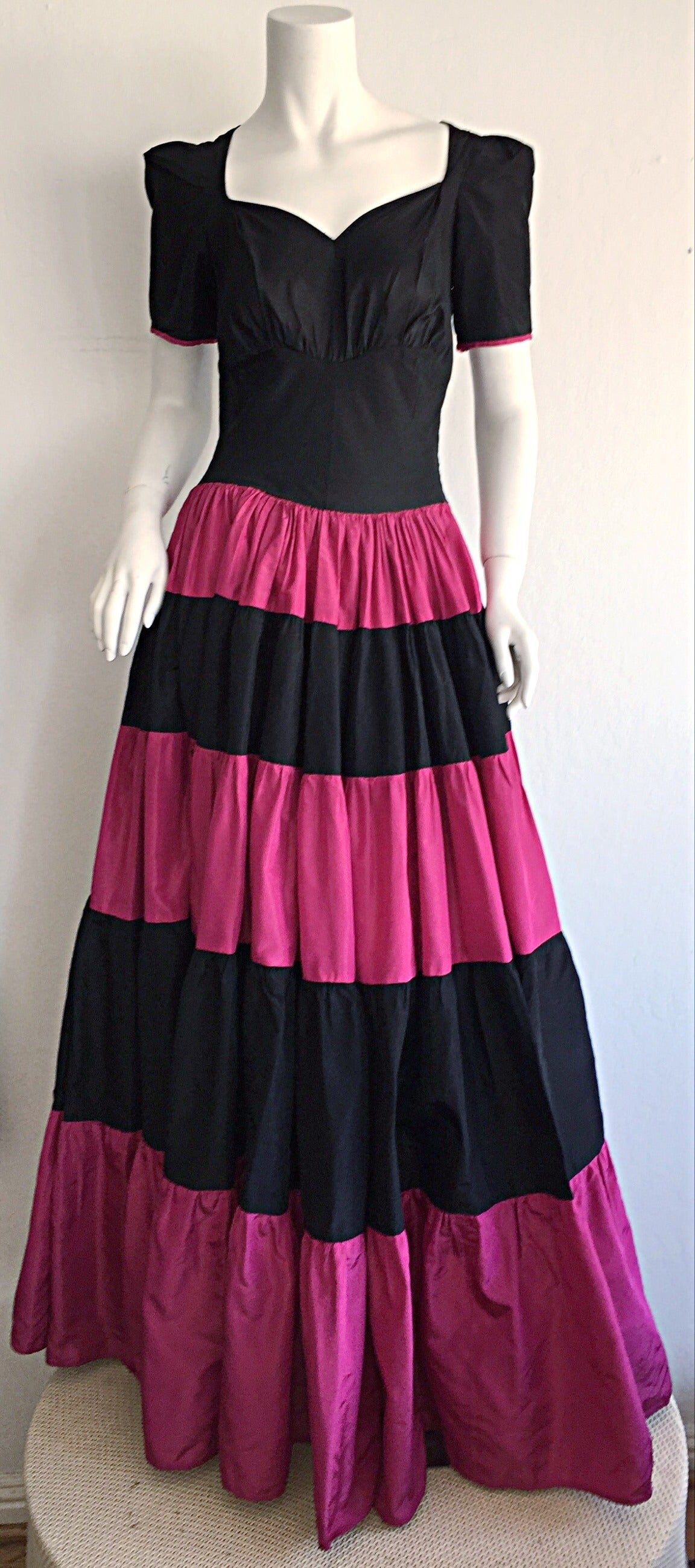 Now, here is a chance to own a piece of fashion history! Drop dead gorgeous 1950s Hattie Carnegie silk taffeta gown! Black and vibrant pink stripes on skirt. Black bodice, with matching pink trim at arm cuffs. Wonderful full skirt, with a flattering