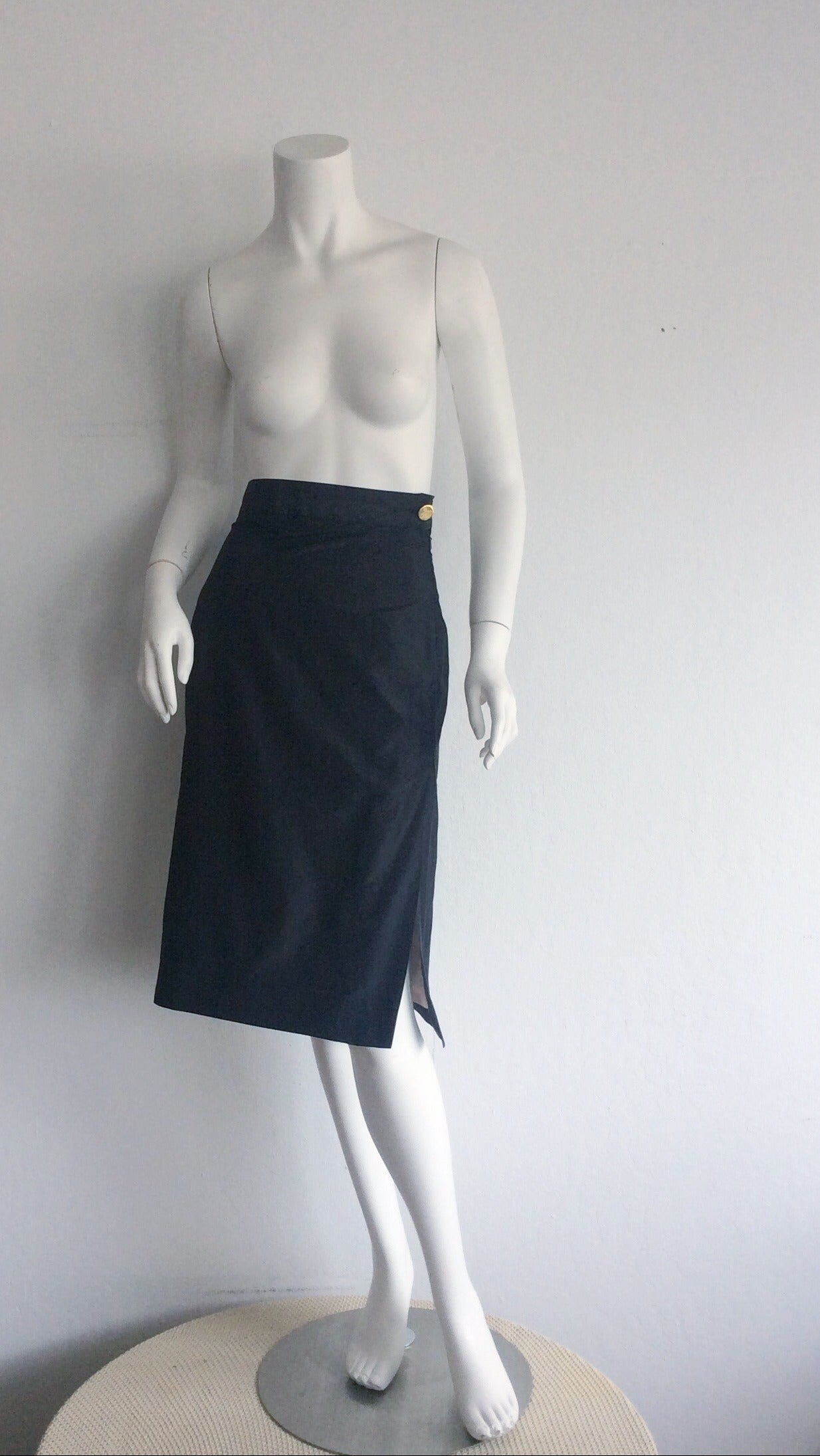 Beuatiful 1990s Vivienne Westwood 'Gold Label' high waisted black silk skirt! Classic piece with a slight, signature Westwood 'edge.' Features gold logo 