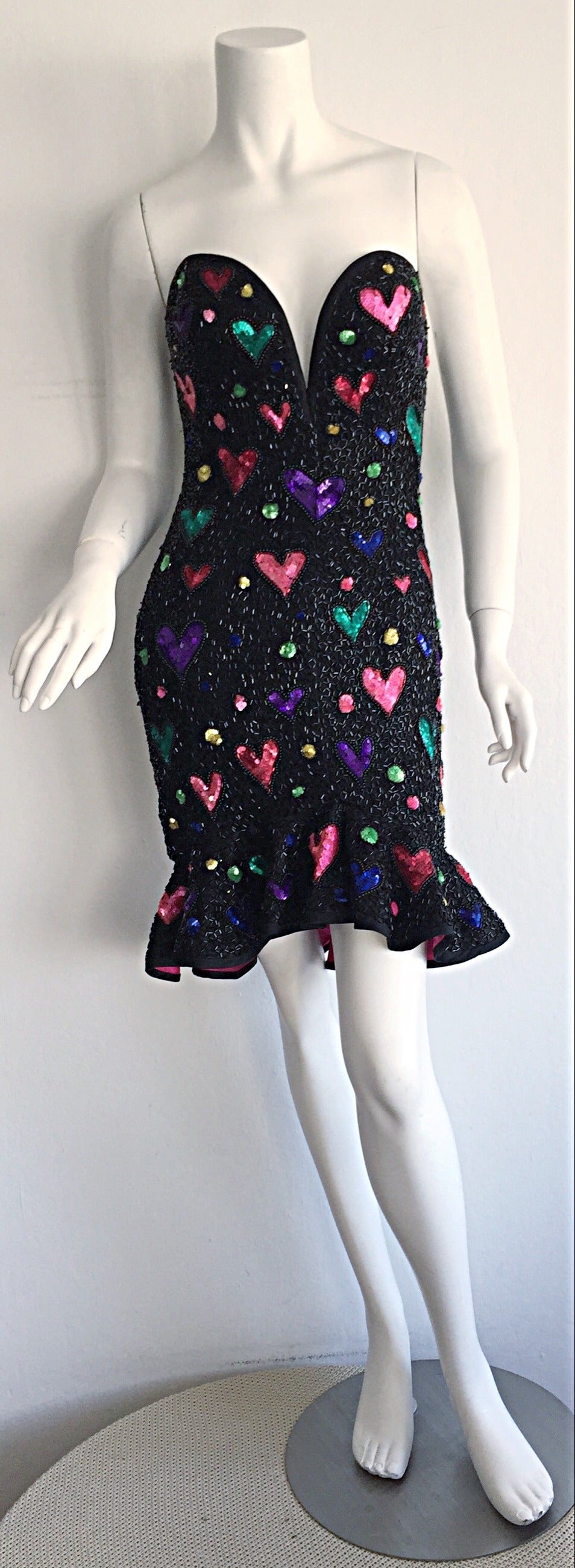 Drop dead gorgeous vintage Bob Mackie silk beaded dress! Features all-over sequins and beads, with sequin hearts throughout the front and back. Ruffle hem, with vibrant pink lining, that flounces with movement. Built in support, that holds