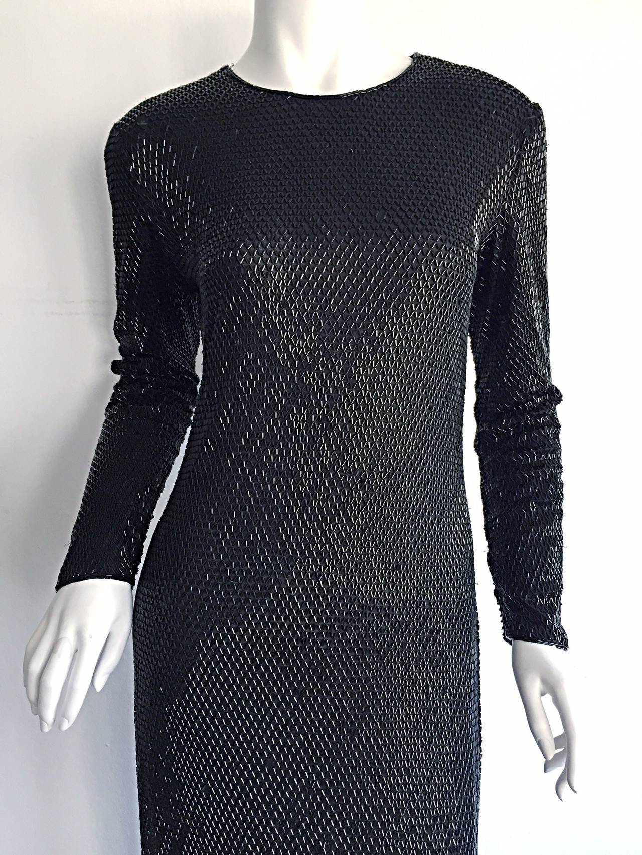Drop dead gorgeous vintage Calvin Klein Collection heavily beaded black dress! 100% silk, with all over beads from head to toe. Body hugging, that flatters the body like no other. Original Runway sample that is in great condition. Fully lined. In