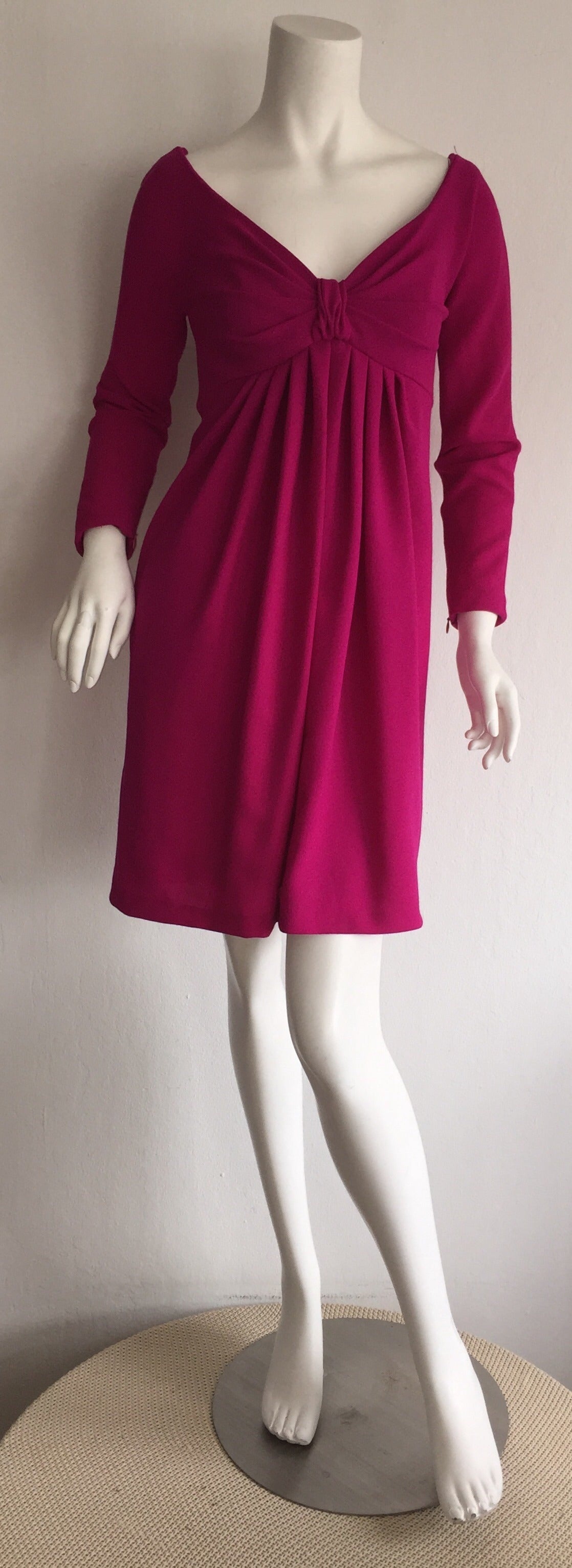 Absolutely beautiful vintage Carolyne Roehm for Neiman Marcus babydoll dress! Impeccable construction to this beauty! Gorgeous vivid fuchsia color. Flattering fit, with a slight empire wait. Long sleeves, with hidden zippers up the sleeve. Can
