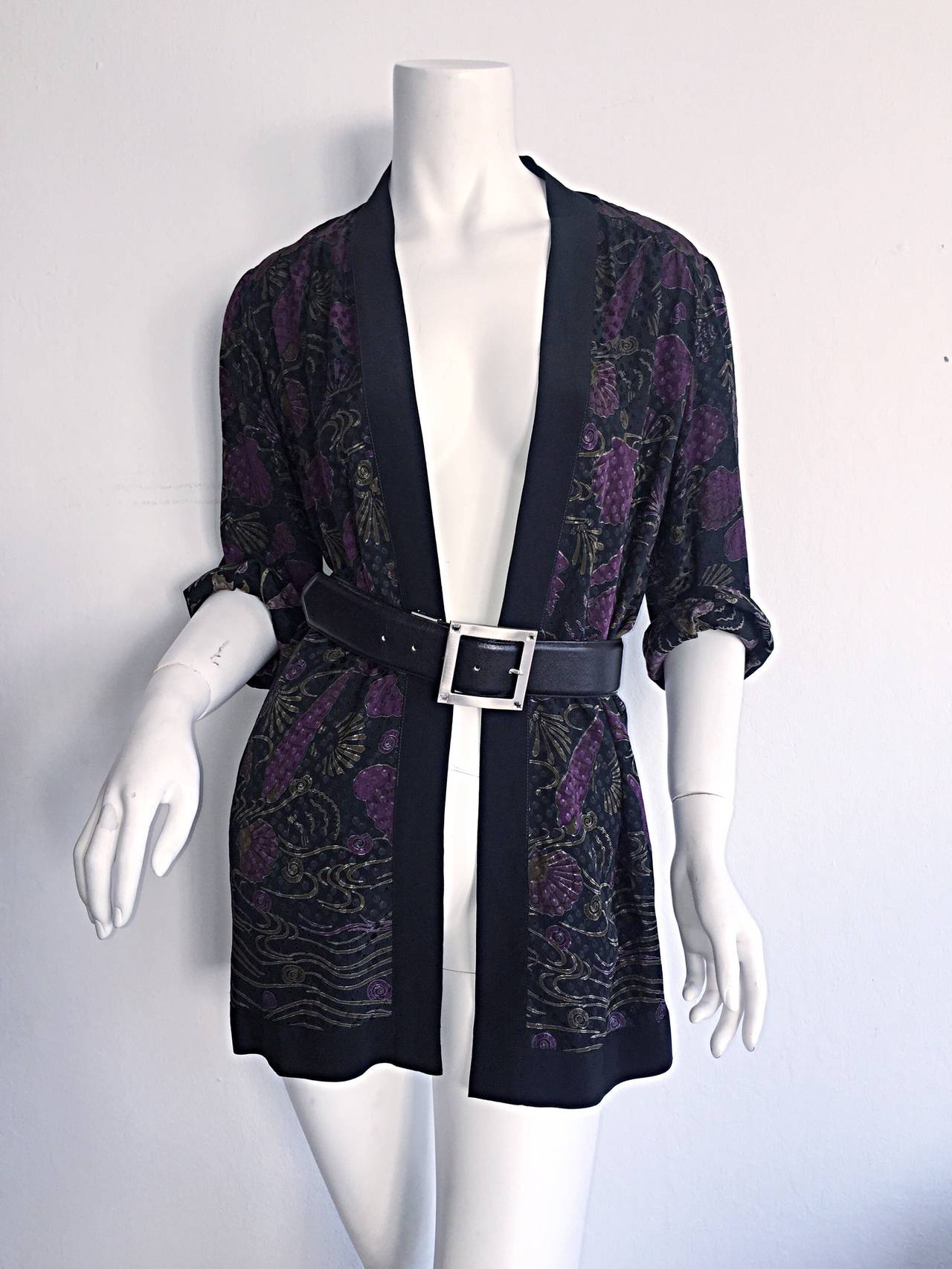 Beautiful vintage Janice Wainwright silk kimono style jacket! Lovely purple fan print throughout. A signature design by this iconic British designer. Looks great alone with jeans and a blouse/tank. Or looks great alone, with a belt. Can easily be