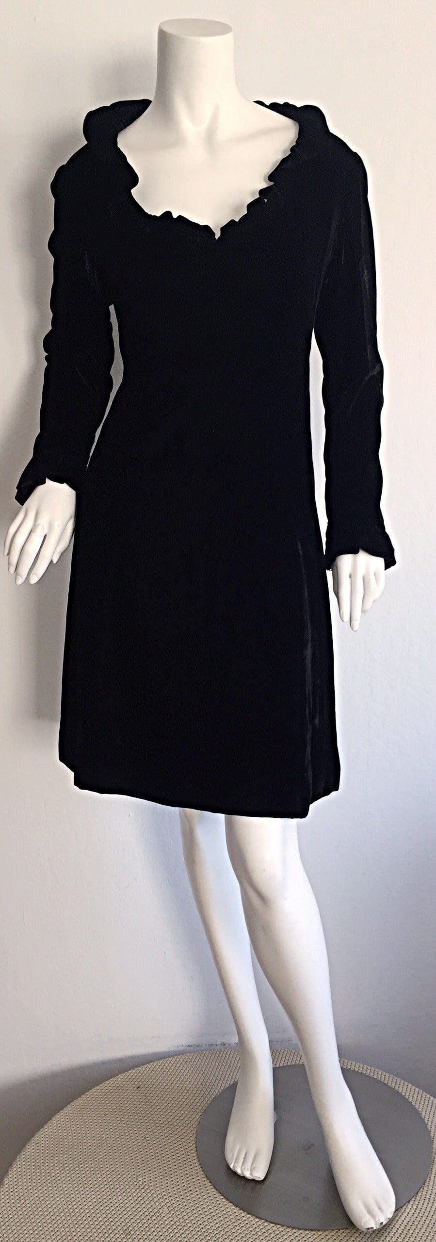 Stunning 1960s Mollie Parnis black silk velvet A-Line dress! Beautiful ruffle neckline, with matching ruffles at cuffs. The perfect little black dress, with an incredibly flattering fit. Jackie-O style. Fully lined in silk. In great condition.