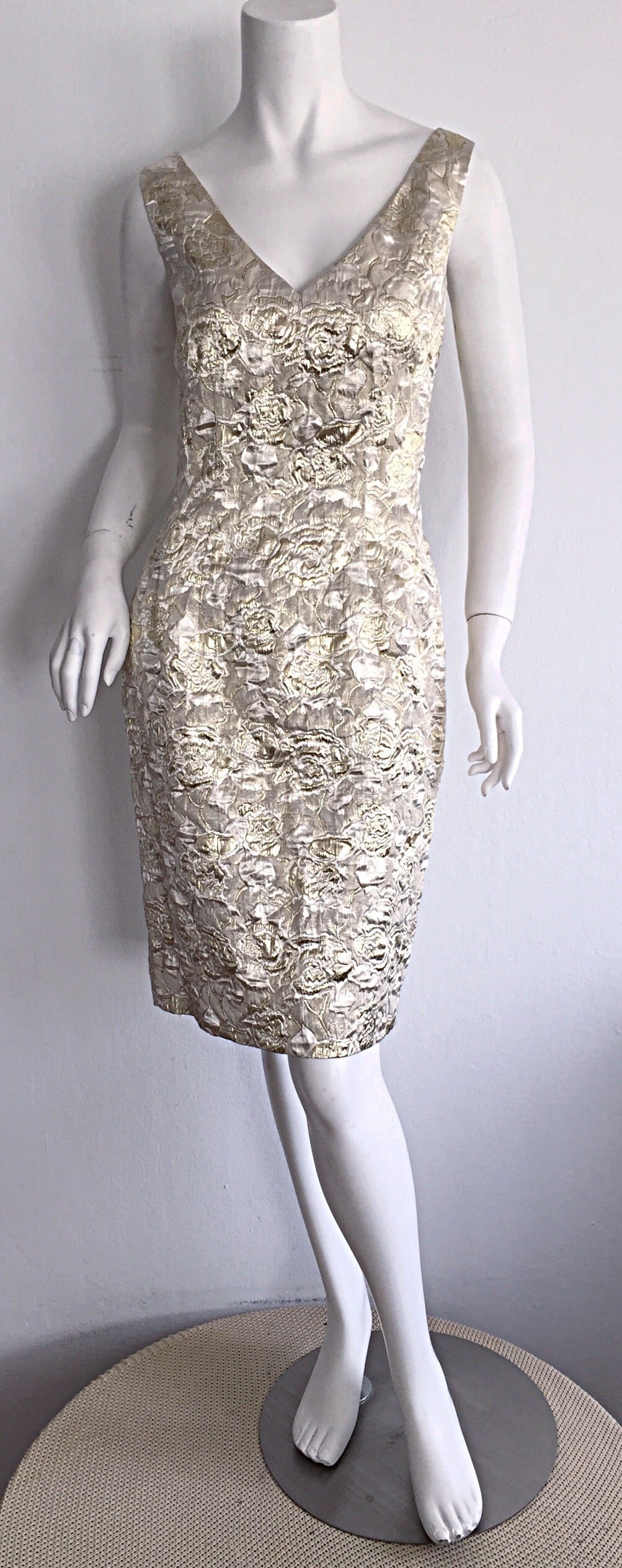 Beautiful vintage Farinae for I. Magnin dress! Gorgeous brocade print of gold and silver throughout. Amazing wiggle fit, that flatters the body like no other! Hidden zipper up the back. Fully lined. In great condition. Marked Size US