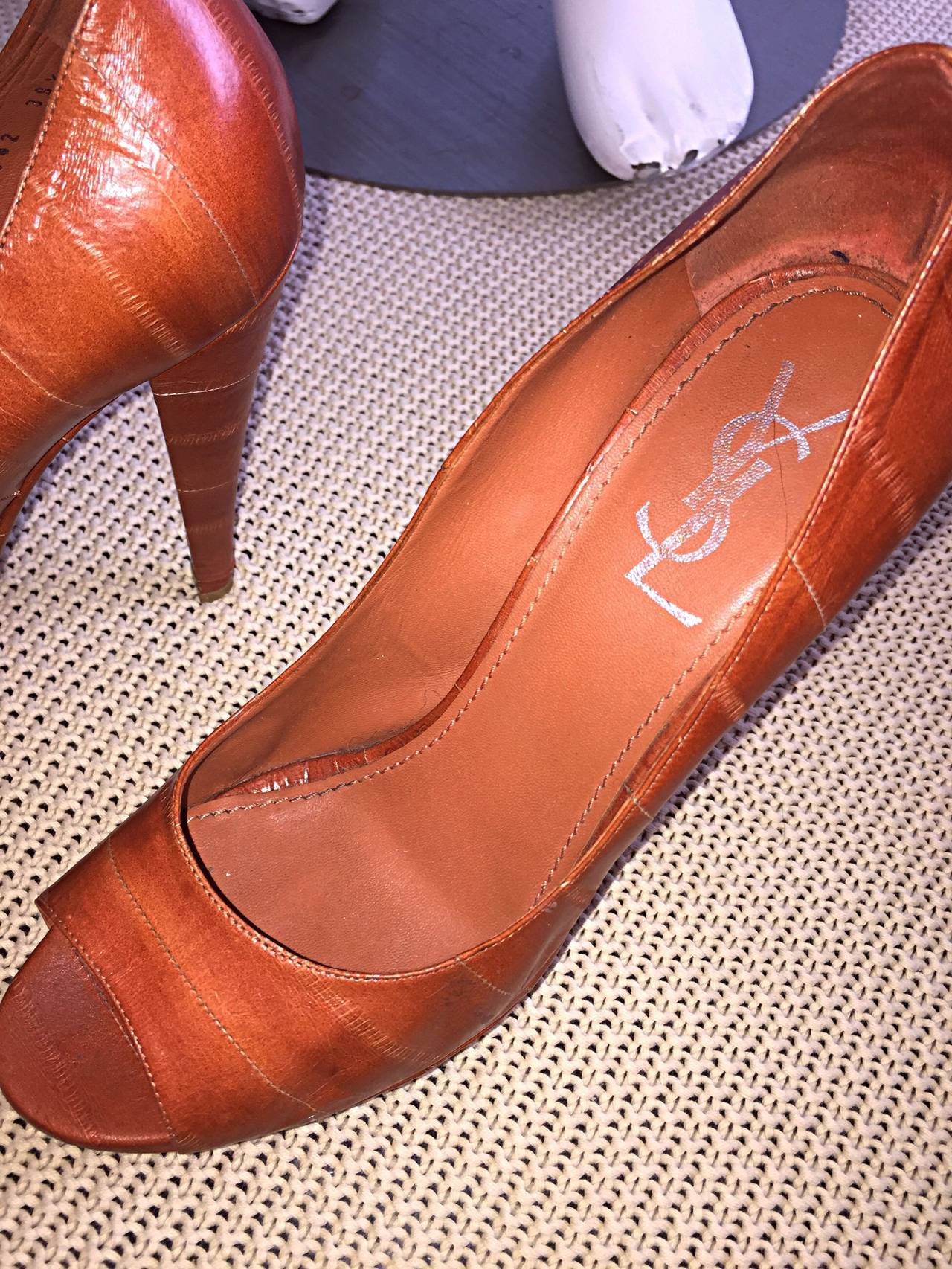Incredible YSL, by Tom Ford eel skin platform heels! Neutral cognac color goes with everything! In great condition, with minor knick on bottom heel (not noticeable). Made in Italy. Marked Size 39.5... Runs true to size.