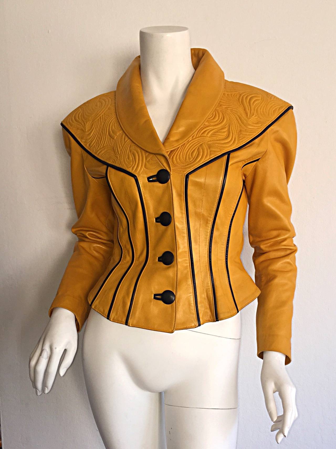 Rare vintage Jitrois yellow leather jacket! Wonderful amounts of handcrafted detail to this beautiful jacket! Mustard yellow color, with embroidery at front shoulders, and top back. Contrasting black leather cords, and black leather buttons. Super
