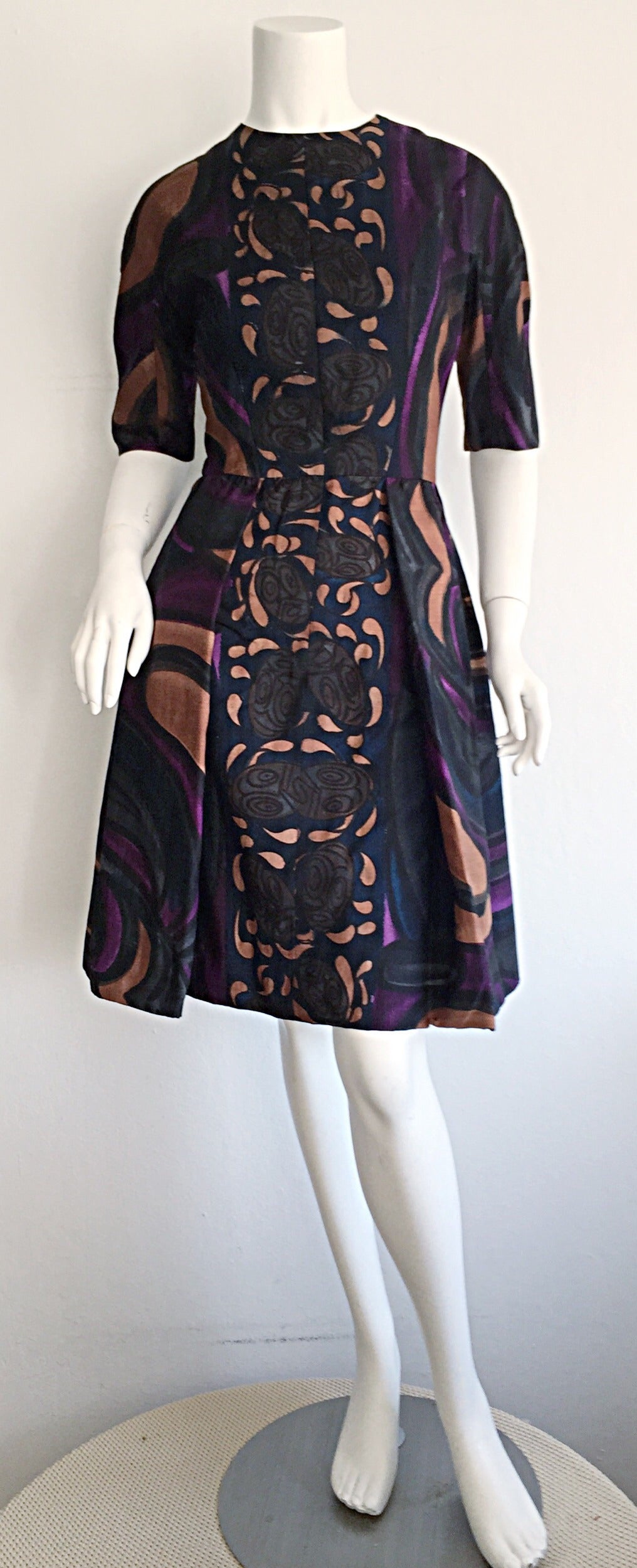 Rare 1950s Diala of Venice dress! Beautiful op-art feel, with Tiki masks down the front! Wonderful full skirt, that could easily accommodate a crinoline. Can easily transition from day to night. Looks great alone, or belted, and with sandals, flats,