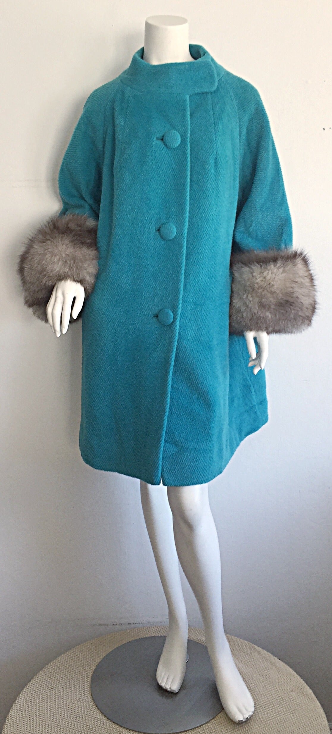 Incredible 1960s Lilli Ann of San Francisco, by Tisse a Paris couture swing coat! Vibrant blue color, with gray fox fur at cuffs. Incredible timeless style, that is extremely versatile! Goes with every color, and every outfit! The PERFECT jacket!