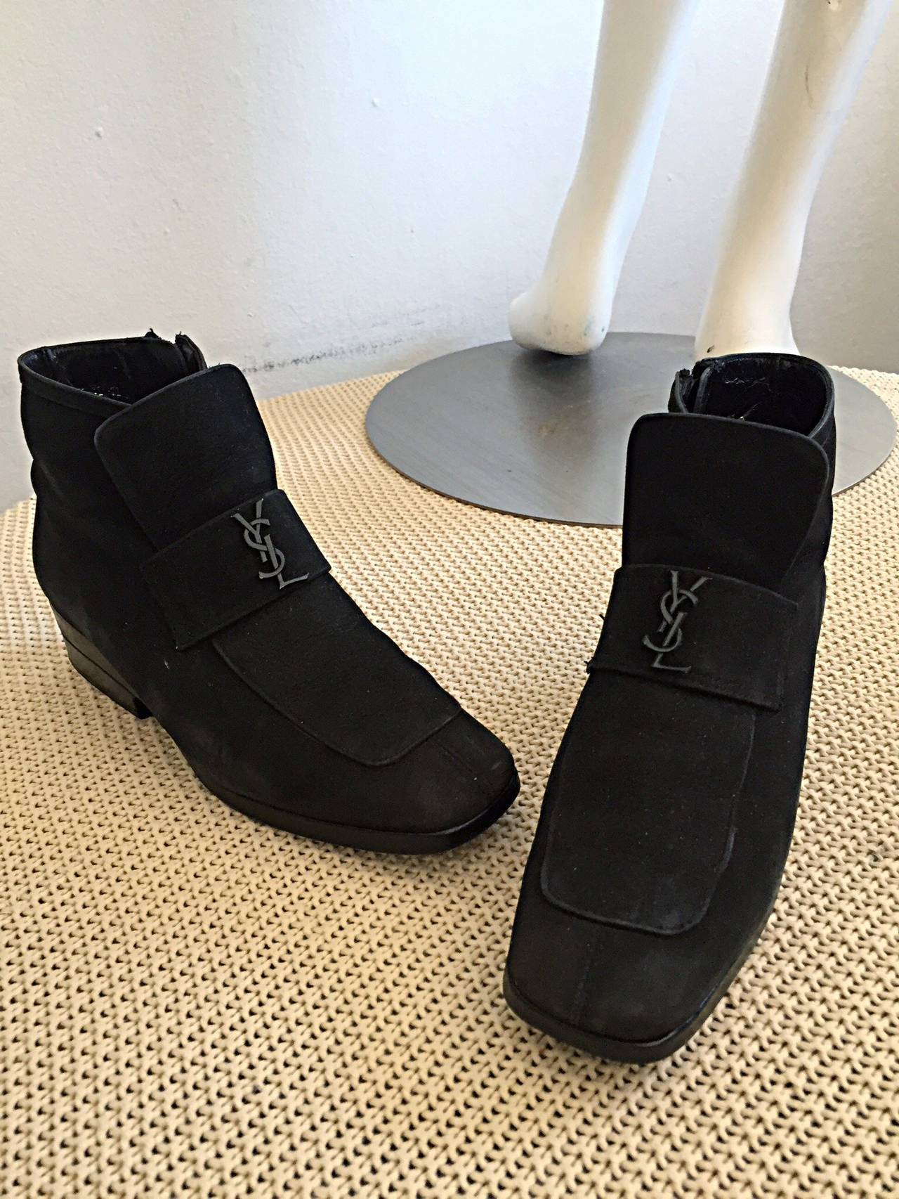 Rare vintage YSL 1960s leather booties! Wonderful style, with YSL logo right below the tongue. Zipper up interior side. Yves Saint Laurent discretly spelt out on back heel. Can easily be dressed up or down. Looks great with jeans, a skirt, a dress,