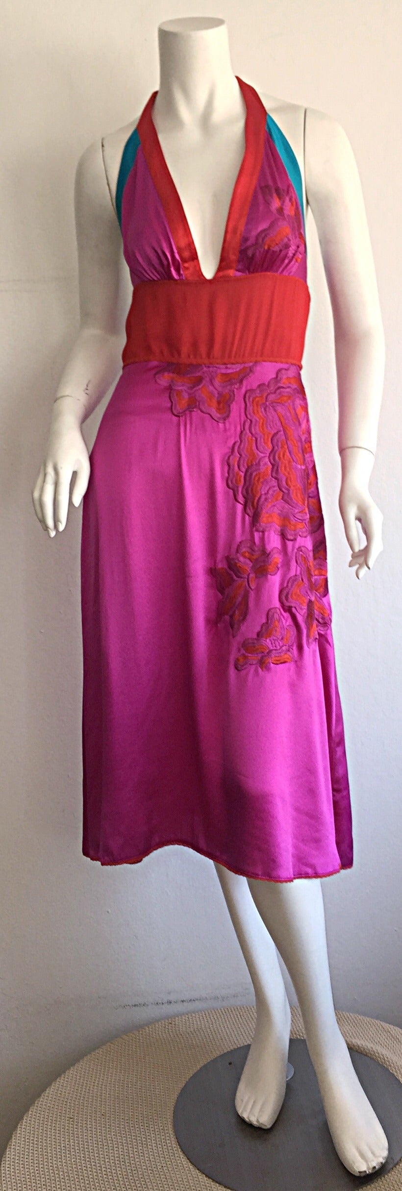 Wonderful sexy Gianfranco Ferre silk dress! Hot pink color, with trims in red and blue, that make for a glorious combination! Intricate red floral embroidery on side of skirt, which drips into the bust. Ties at neck, and back, making this perfect