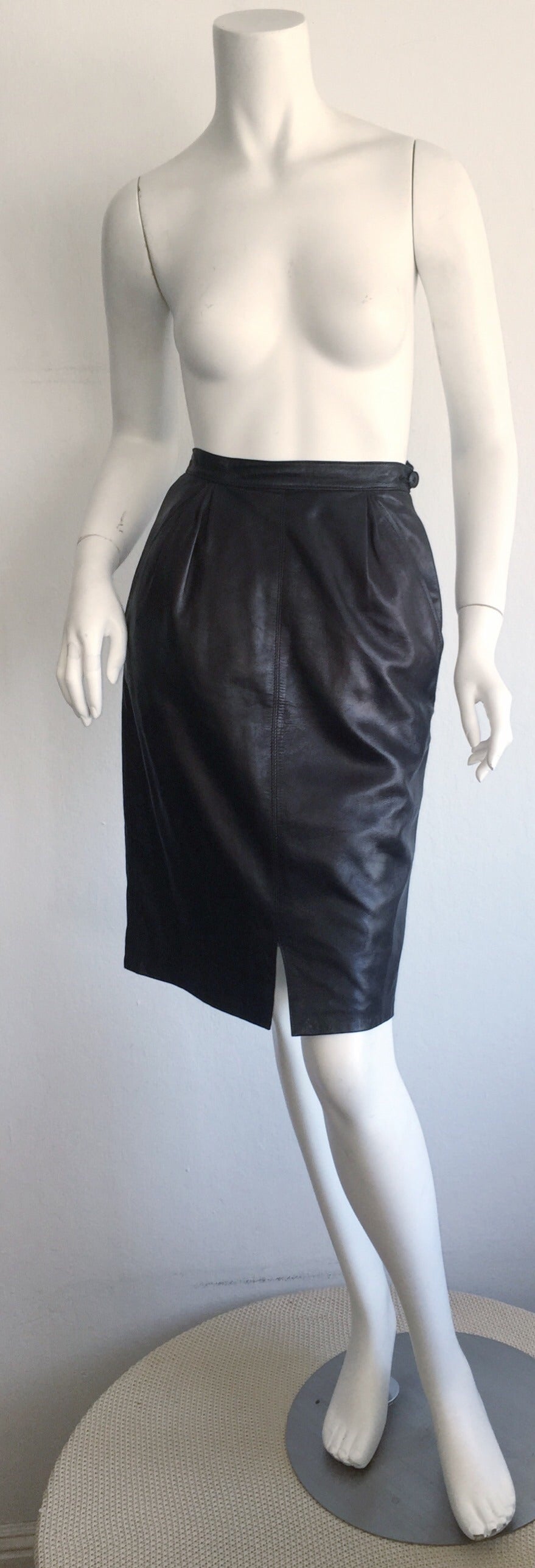 Incredibly sexy vintage Yves Saint Laurent YSL ‘Rive Gauche' black leather skirt!!! High-waisted pencil style, with pockets at both sides of waist. Slight slit up middle front makes easier for walking. Looks great casual or dressy! Fully lined. 100%