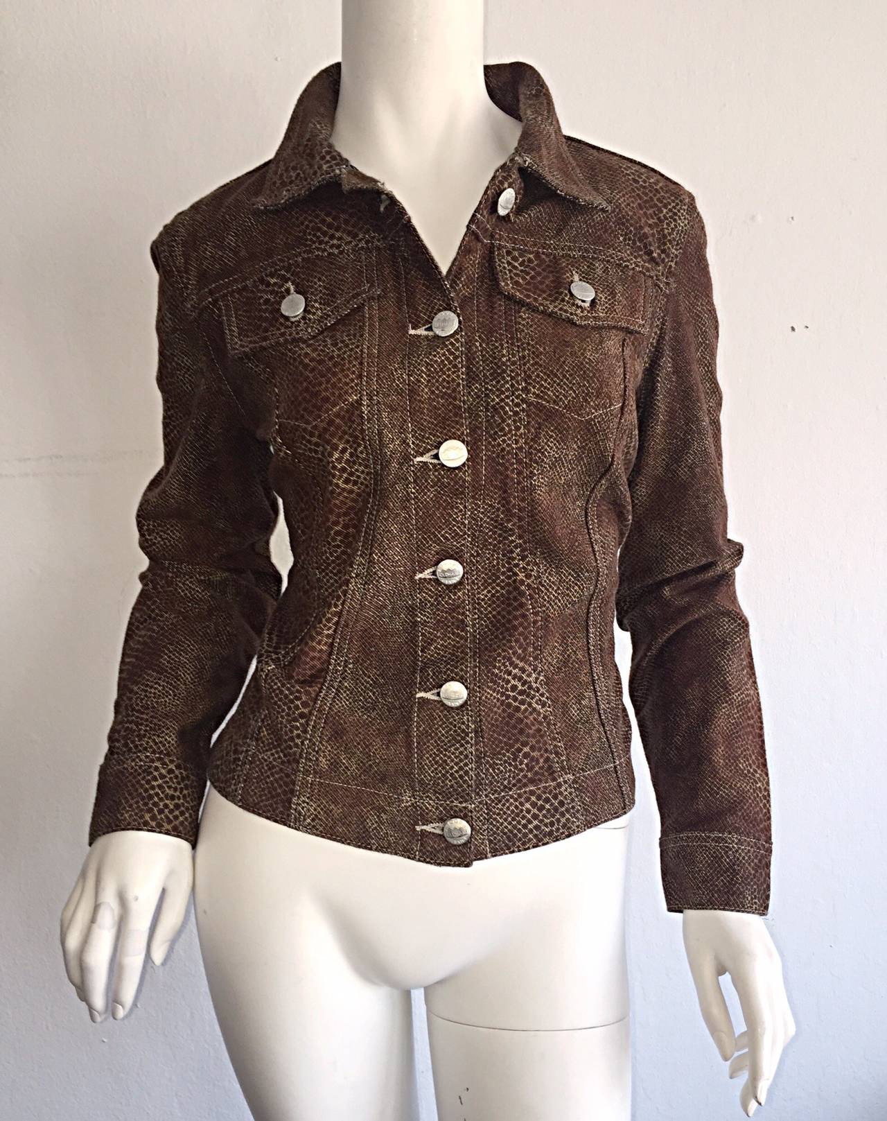 Amazing 1990s Todd Oldham snakeskin print denim jacket! Classic snakeskin print in brown and black, with signature silver buttons down the front, at cuffs, pockets and at adjusting back waist. Can easily be worn a number of ways--Goes with