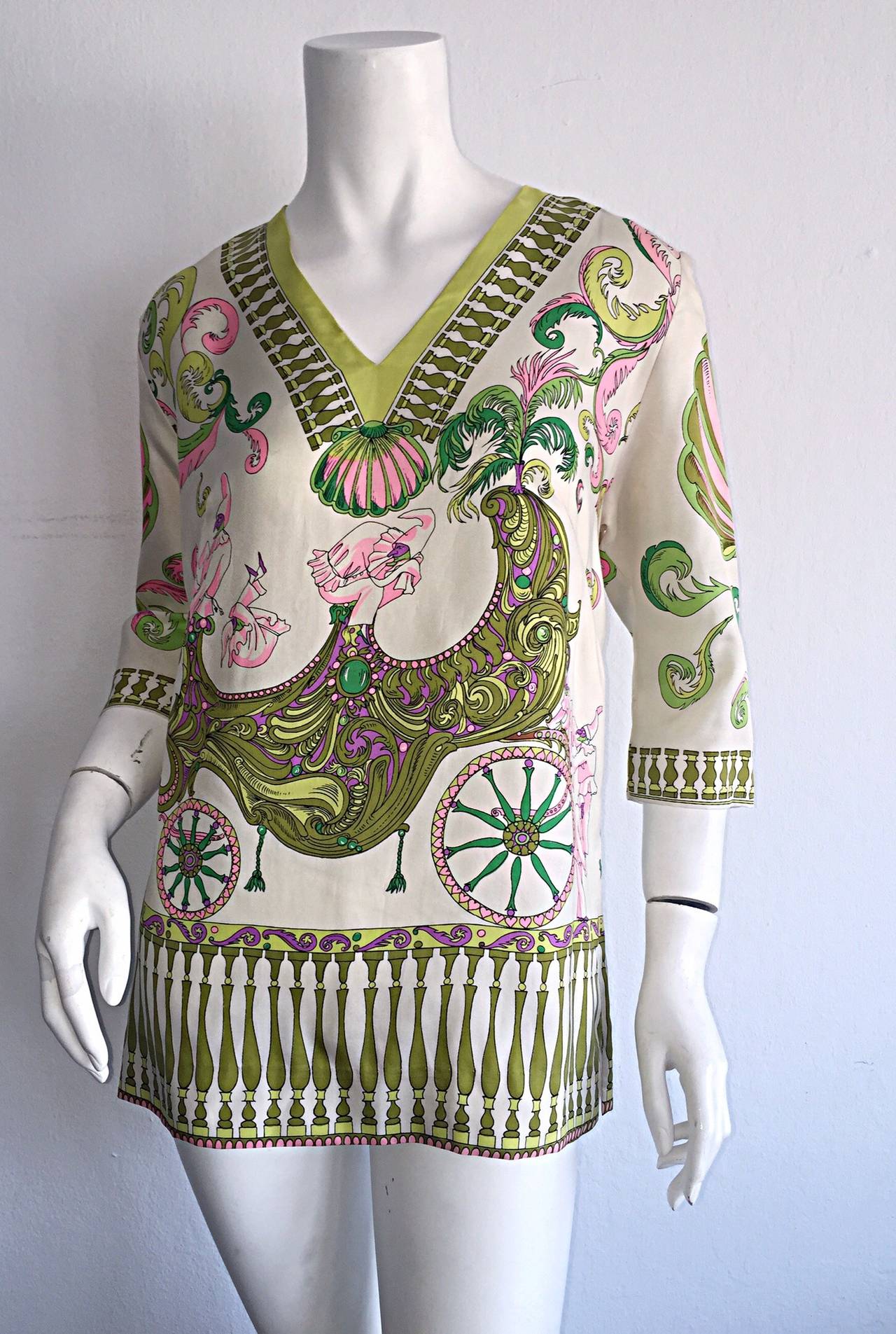 Extraordinary AND super rare! 1960s Oleg Cassini silk tunic blouse! Wonderful print of dancing jokers, and circus like print throughout. Silk covered buttons up the back. Vents on each hip. Vintage pieces like this beauty, from Oleg Cassini, are