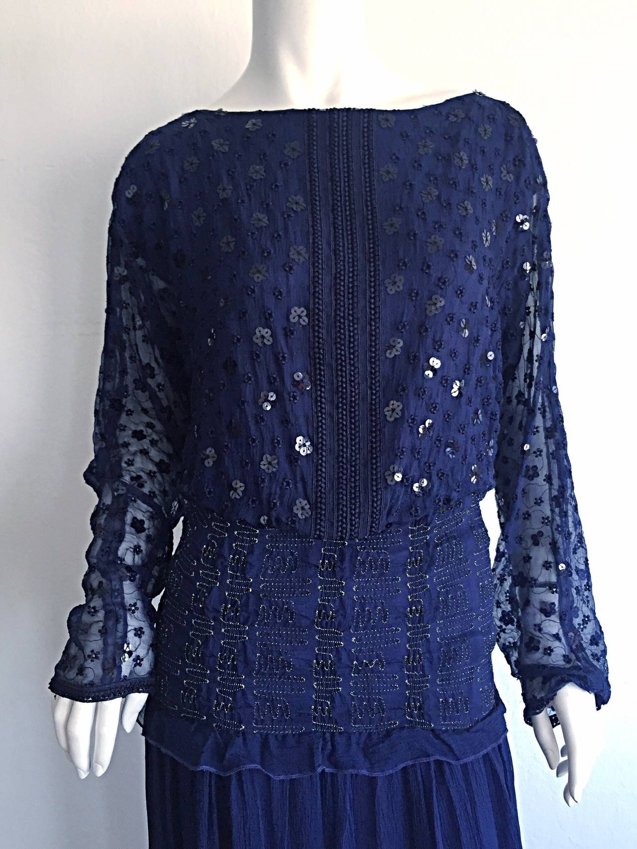 Gorgeous vintage Marian Clayden for Bergdorf Goodman navy blue silk chiffon Bohemian dress! Eyelets throughout the front and back bodice, with black sequins in shapes of flowers. Intricate black embroidery down the front center. Dolman sleeves.