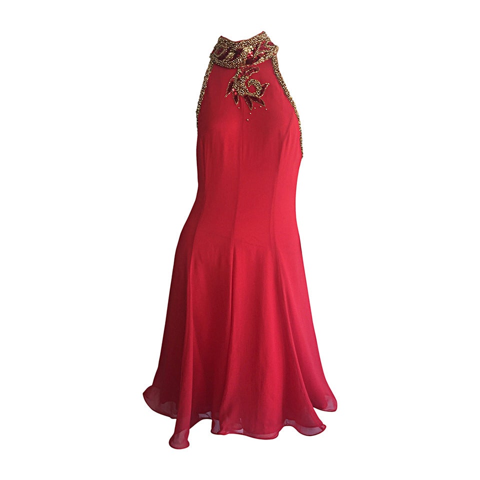 Beautiful vintage red dress attributed to Bob Mackie! Layers and layers of red silk chiffon, with an elegant beaded neck. Sexy beaded straps on the back. Definitely a showstopper! Looks fantastic on the dance floor! In great condition. All interior