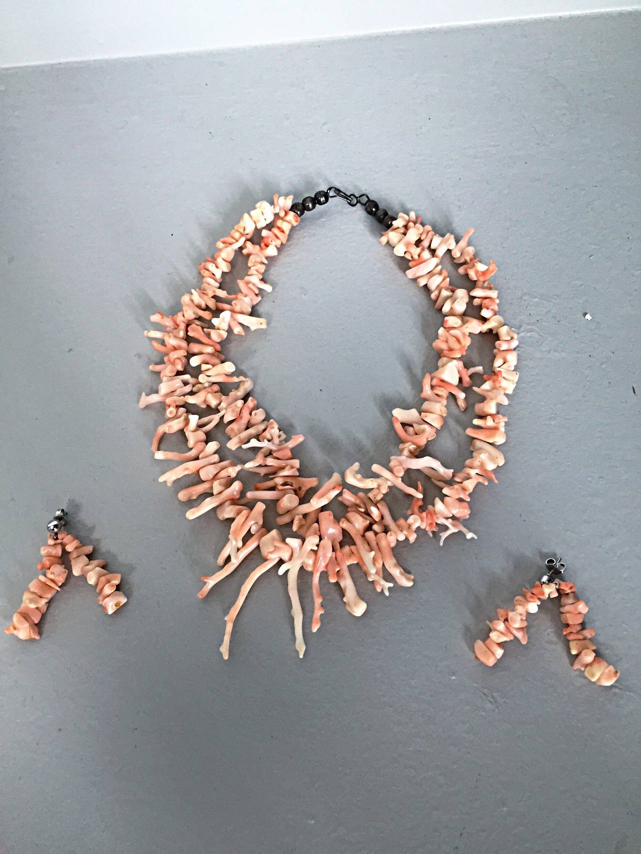 Stunning vintage Angel Skin coral necklace and earrings set! Necklace features a double strand of long branch Angel Skin coral, and earrings feature double strands of Angel Skin coral. Very rare to find this type of coral in this size! Beautiful