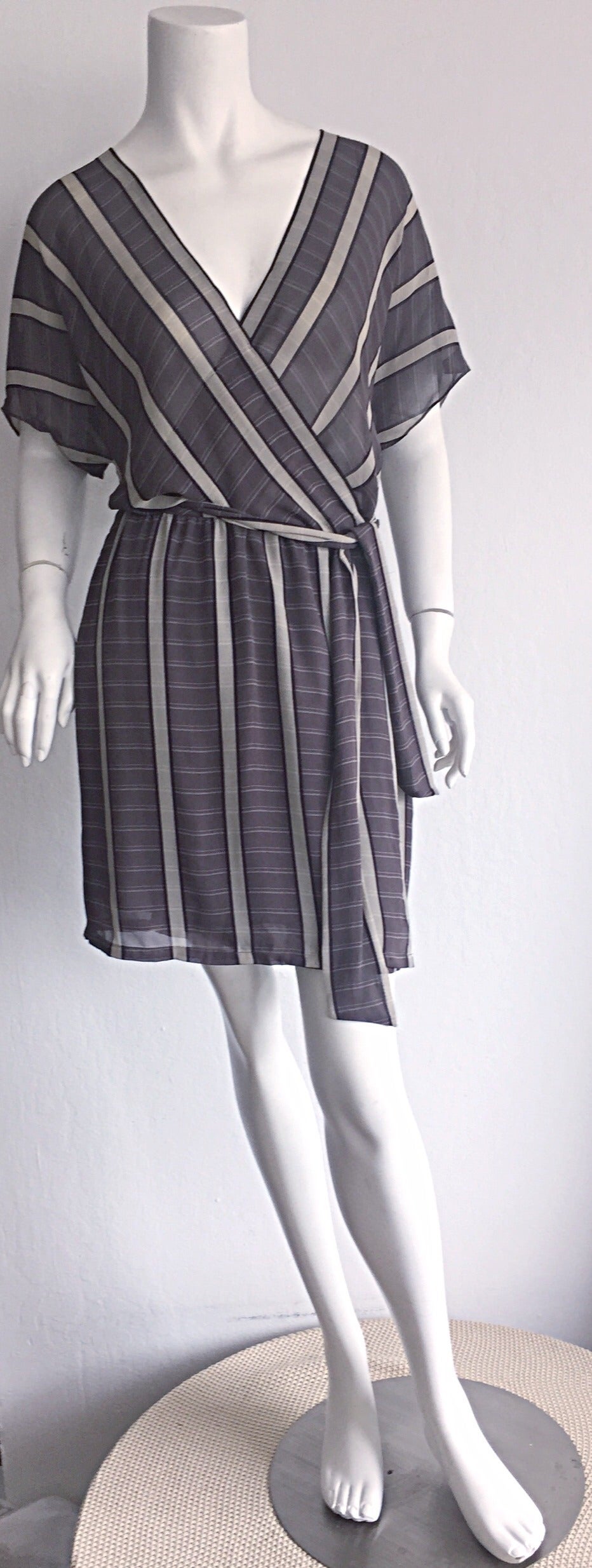 Wonderful vintage 1990s Calvin Klein Collection 'bamboo' striped silk wrap dress! Warm tones of grey, black, and taupe, with contrasting stripes throughout create an ultra slimming effect! Great slouchy fit, with an attached wrap belt to cinch in