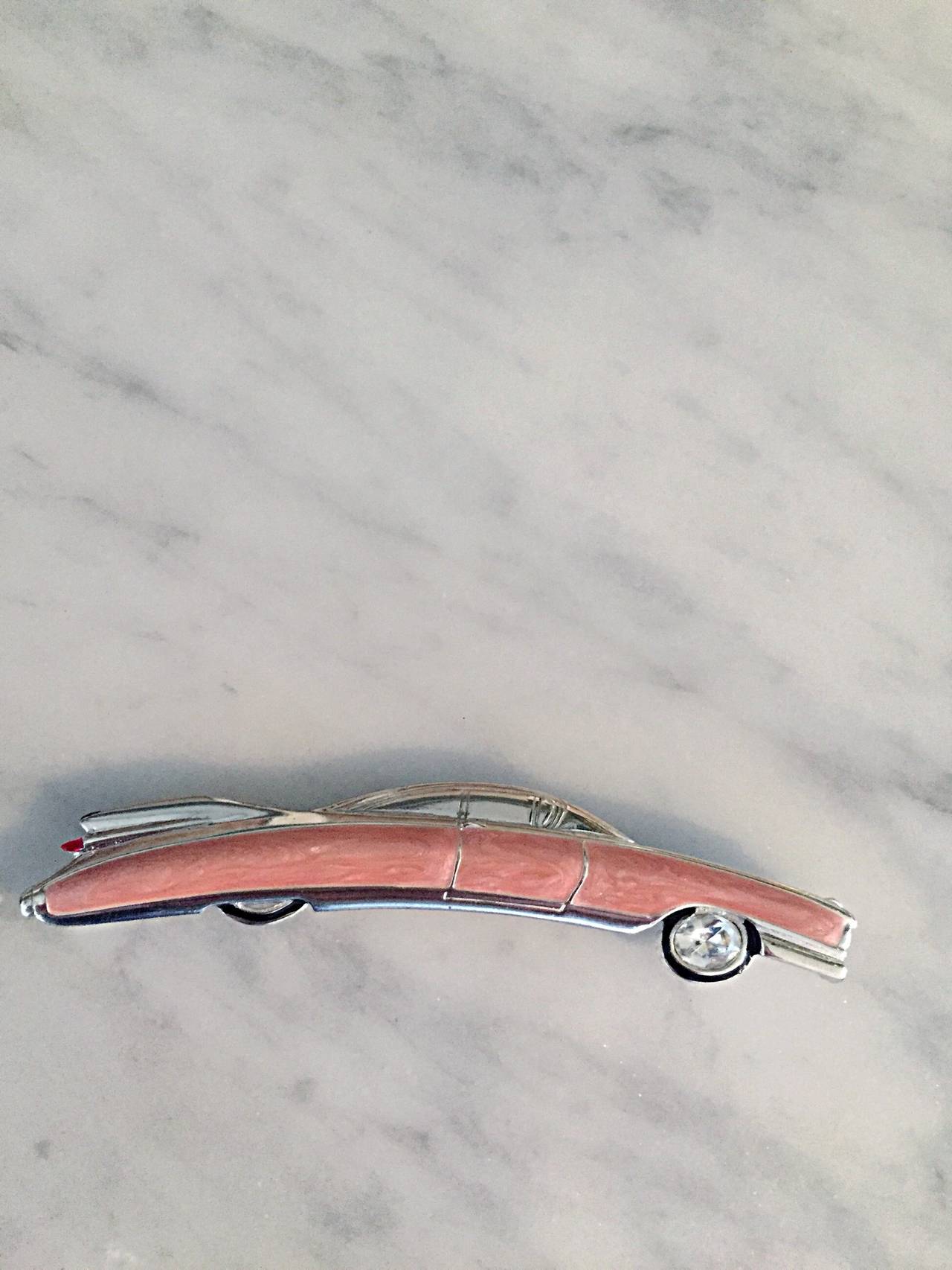 Amazing vintage Bob Mackie 'Pink Cadillac' brooch/pin! The perfect accessory for any blouse, sweater, or jacket! Pink enamel, with intricate details. Signed 'Bob Mackie' on back. In great condition. Measures 4 inches long.