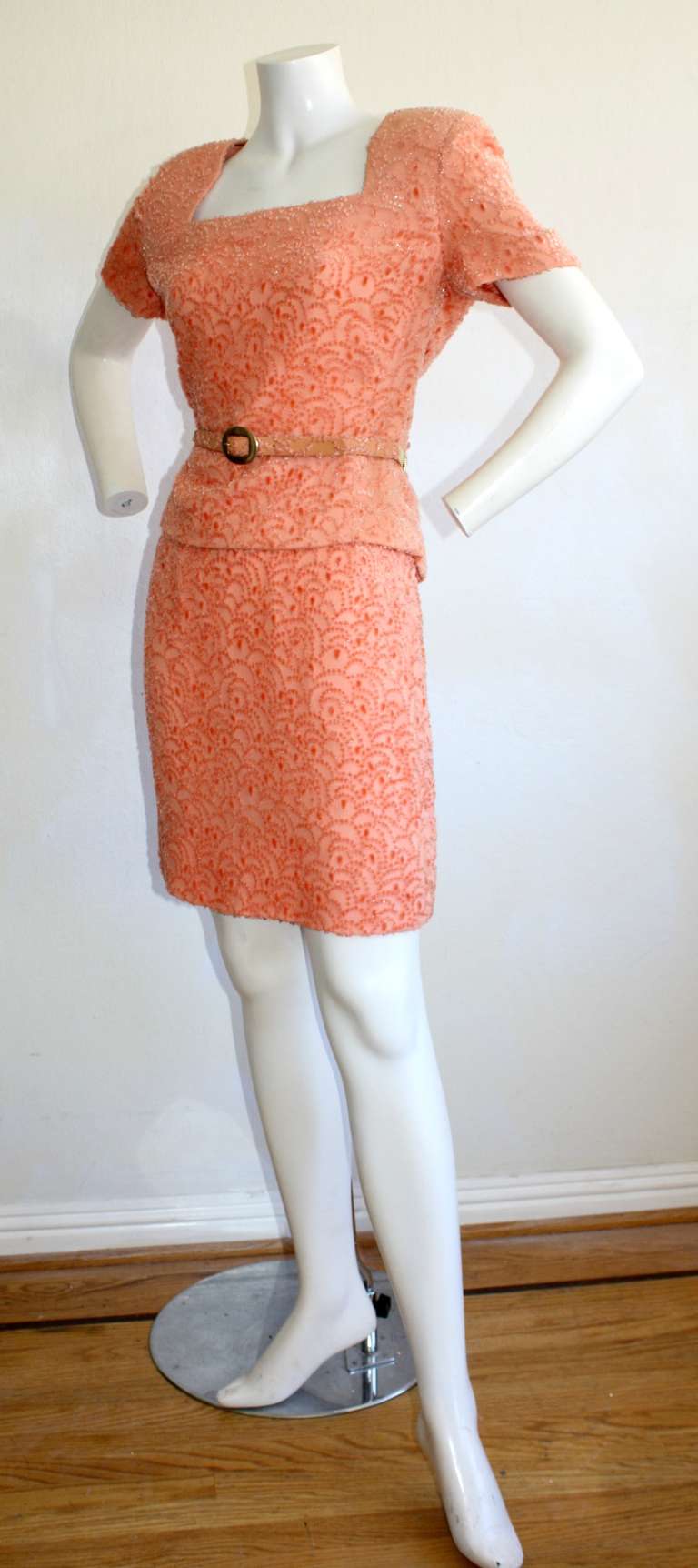 Gorgeous Brand NEW Vintage Galanos salmon colored skirt suit, with matching belt. Brand new with tags from Neiman Marcus. Retailed for $4,370 in the 1990s. All three pieces work great as separates. Marked Size 10. More like Size 6/8. Please see