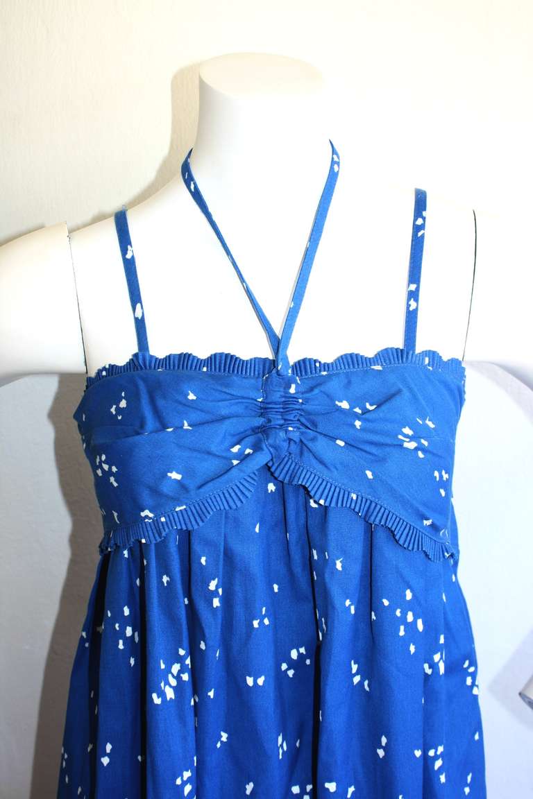 Beautiful vintage 1970s Bill Tice hand painted dress. Shelf bust, spaghetti straps, and adjustable halter ties. Features pockets on either side of waist. Scallop detail at bust. Approx. Size small-medium, with free waist, and free
