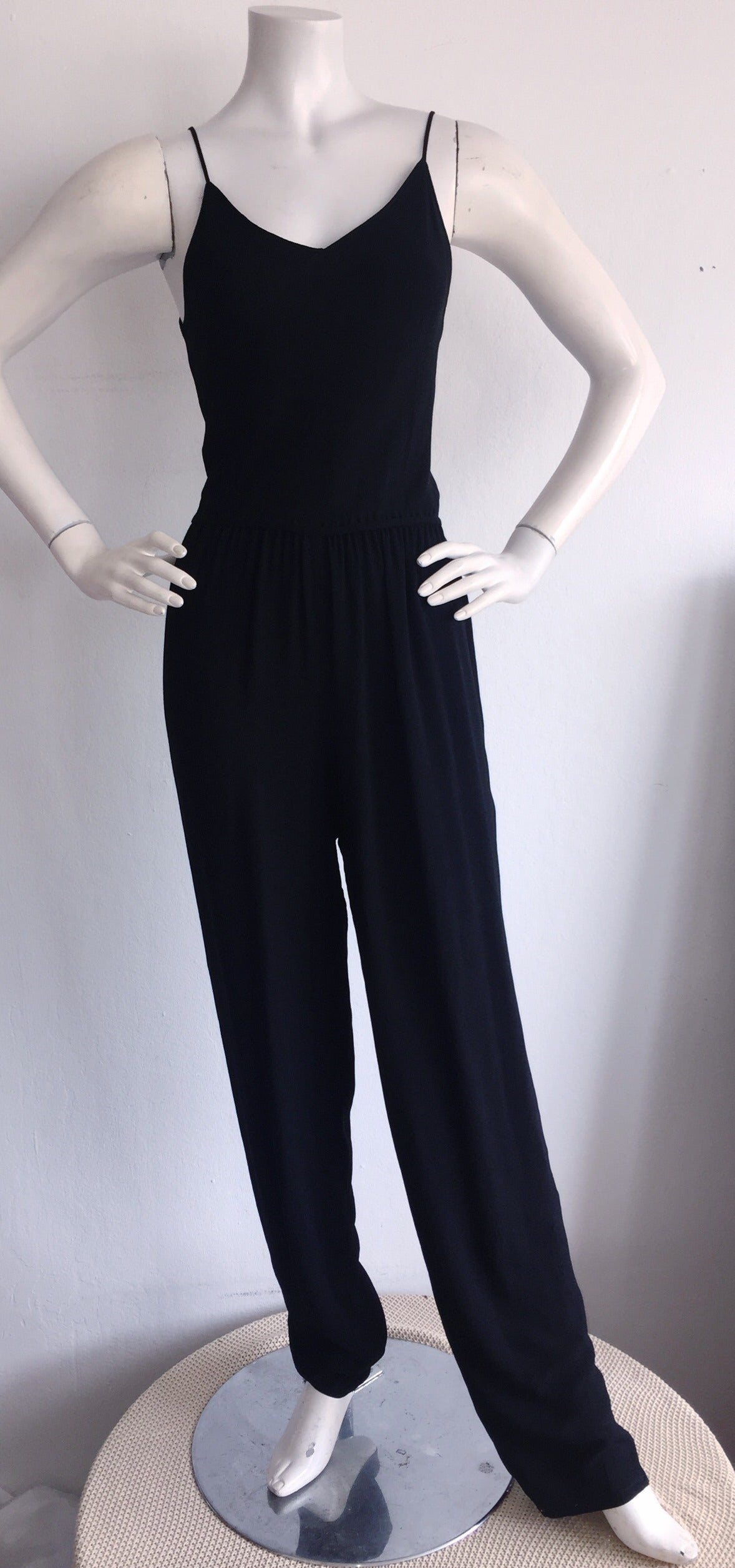 Amazing vintage Judy Hornby Couture black crepe jumpsuit! Flattering from both the front, and the back! Features snaps on the interior of both leg openings (to make legs more tapered, if desired). Looks great alone, or with a belt. Easily