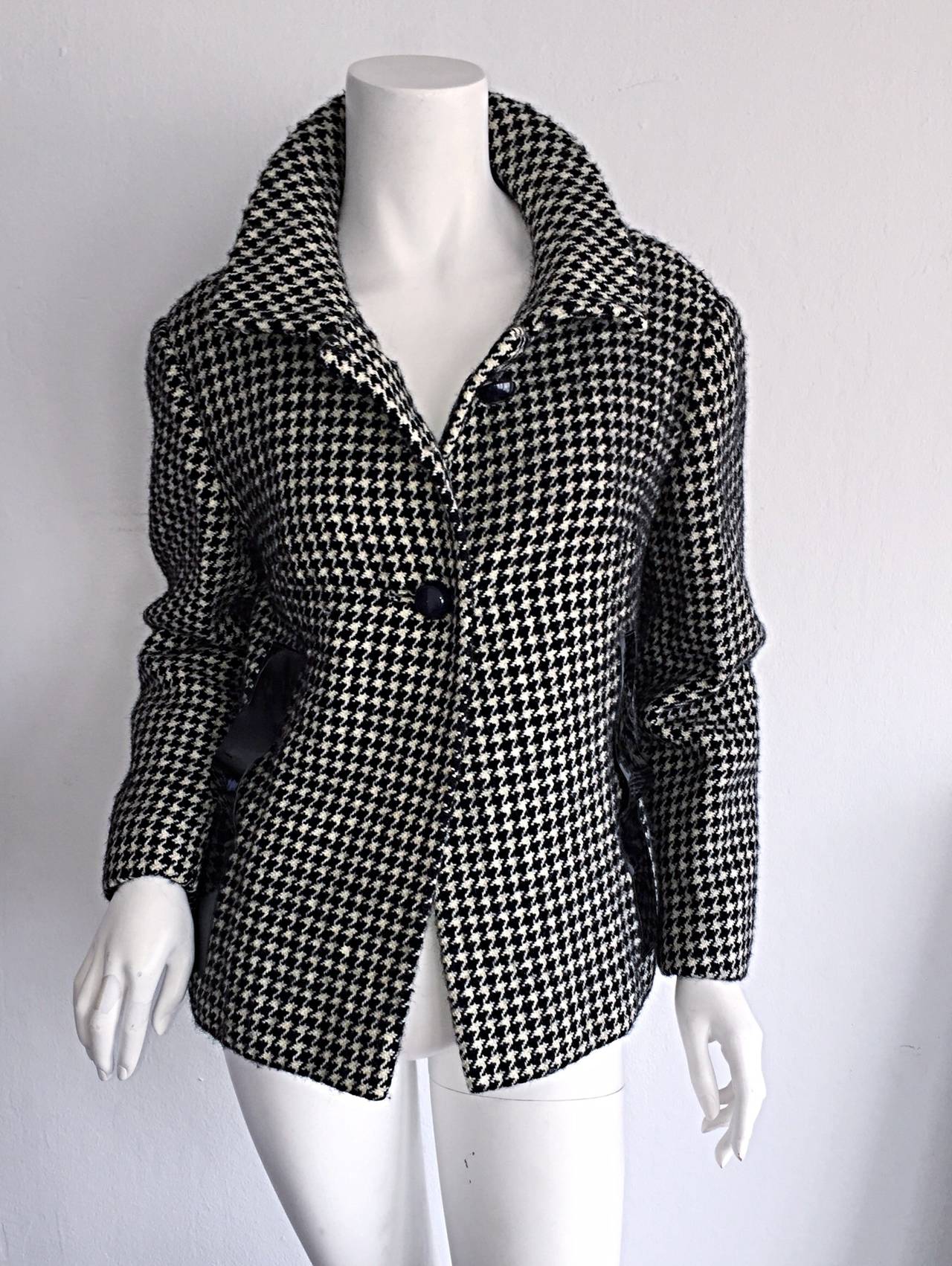 Incredible and Rare! Vintage 1960s Pierre Cardin Couture black and white houndstooth swing jacket! Signature vinyl detail at either side of waist. An amazing piece of fashion history! Looks great from day to night. Made in France. In great