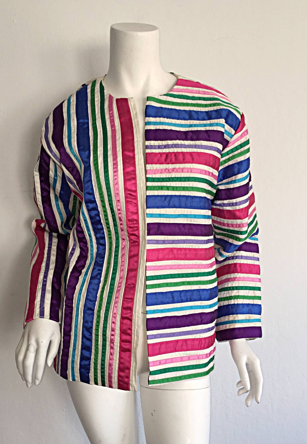 Amazing vintage Tachi Castillo cotton jacket! Features panels of colorful ribbons throughout. Hook-and-eye closure down front. Looks amazing on! Extremely versatile. In great condition. Approximately Size Small-Medium

Measurements:
38-40 inch