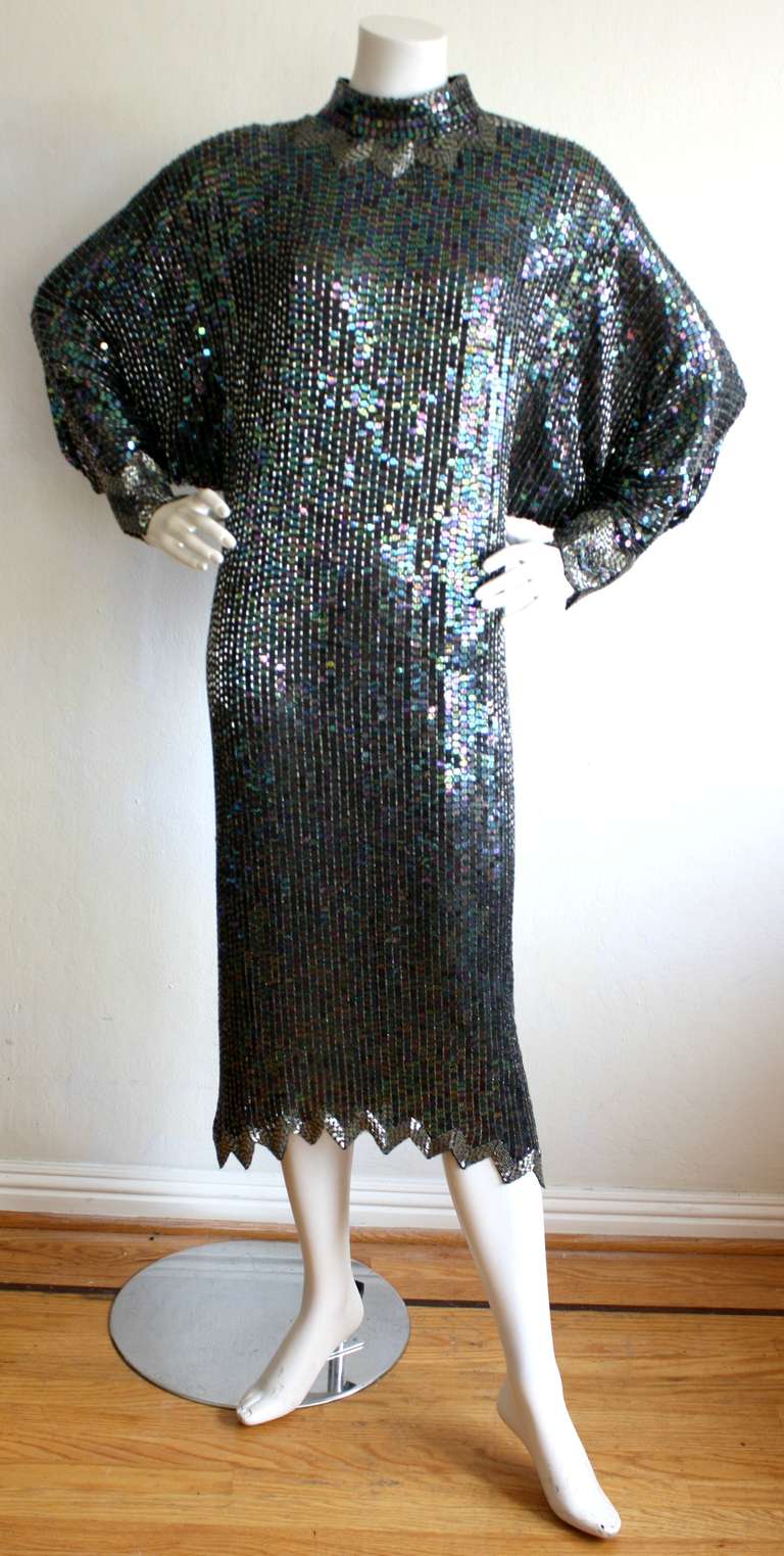 Halston was know for his incredible eye to detail, amongst many things. This vintage Halston dress is no exception! All-over metallic sequins and beads, with very impressive dolman sleeves. Hook closures at neck, with intricate beading that matches