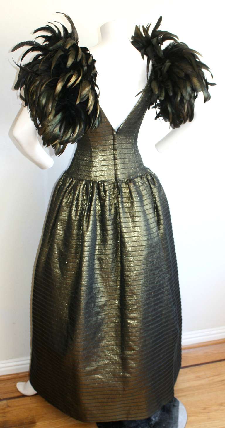 Beautiful metallic feathers adorn this lovely vintage Victor Costa gown! Metallic gold and black striped pattern, with a sexy plunging back. Size Small