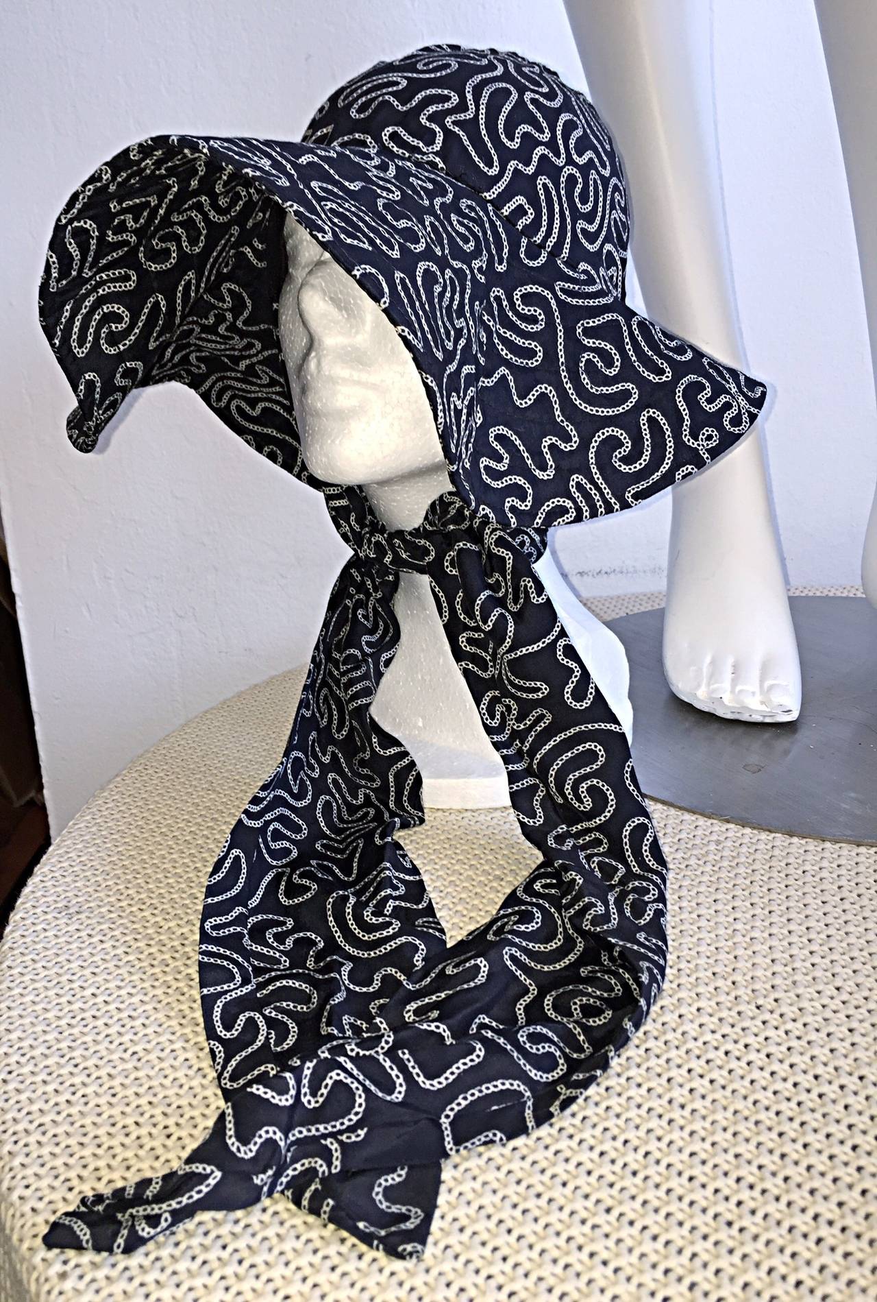 Incredibly rare vintage Norma Kamali for Stetson wide brimmed hat, with attached scarf. Kamali designed a line for Stetson hats in 1983, thus making these extremely hard to find! Amazing white + black 'swirl' print throughout. A true piece of