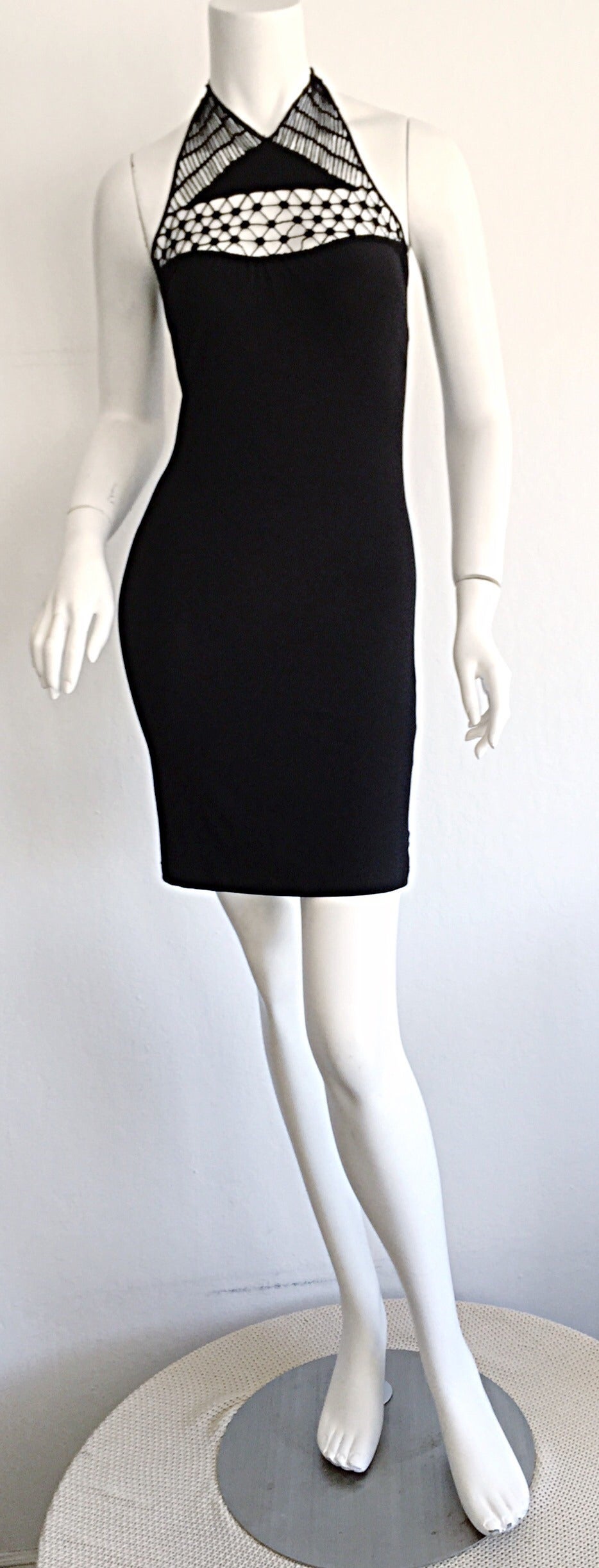 Sexy vintage Gianni Versace little black bondage dress! Features crochet cut-out at neck, with halter ties. Extremely flattering fit, with lots of stretch! Made in Italy. In great condition. Approximately Size Small-Medium (lots of