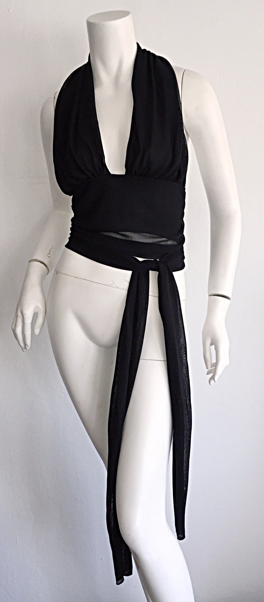 Sexy Vintage Donna Karan 'Plunging' halter top! Can be worn a number of ways...with sash tied in the front, or back. Layers and layers of fabric, that drape the bodice wonderfully! Can easily be dressed up or down. Looks great with shorts, trousers,