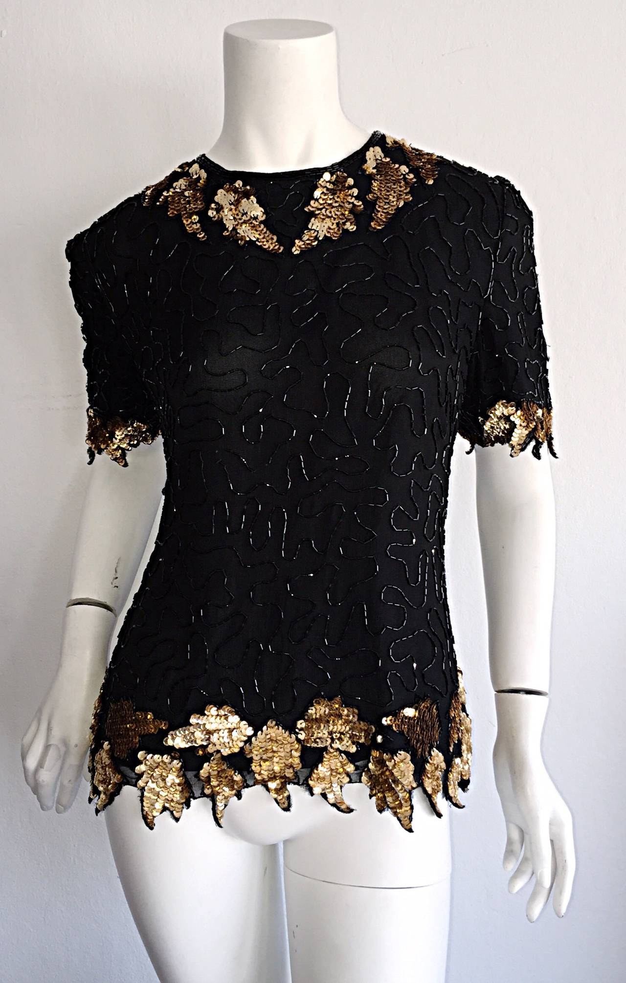 Beautiful vintage black silk beaded top! Encrusted with dozens and dozens of beads and sequins! Scalloped edges, with leaf motifs. Keyhole back. Can easily be dressed up or down. Looks great with jeans, or a skirt. In great condition. Marked Size