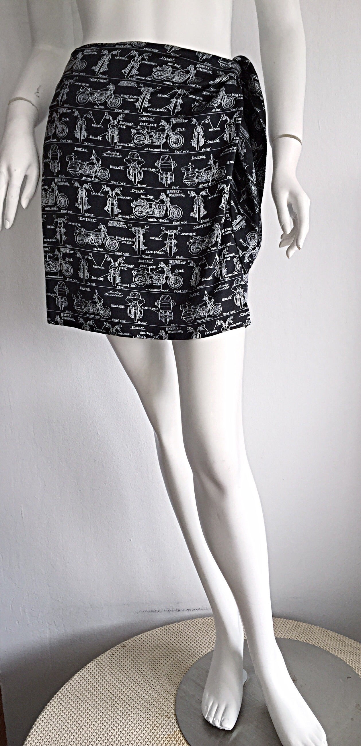 Awesome rare vintage Nicole Miller 'Limited Edition' black and white silk wrap skirt! Features Harley Davidson/Motorcycle print. Only very limited quantities of this skirt were made, and no two were the same. Features interior button, and side wrap