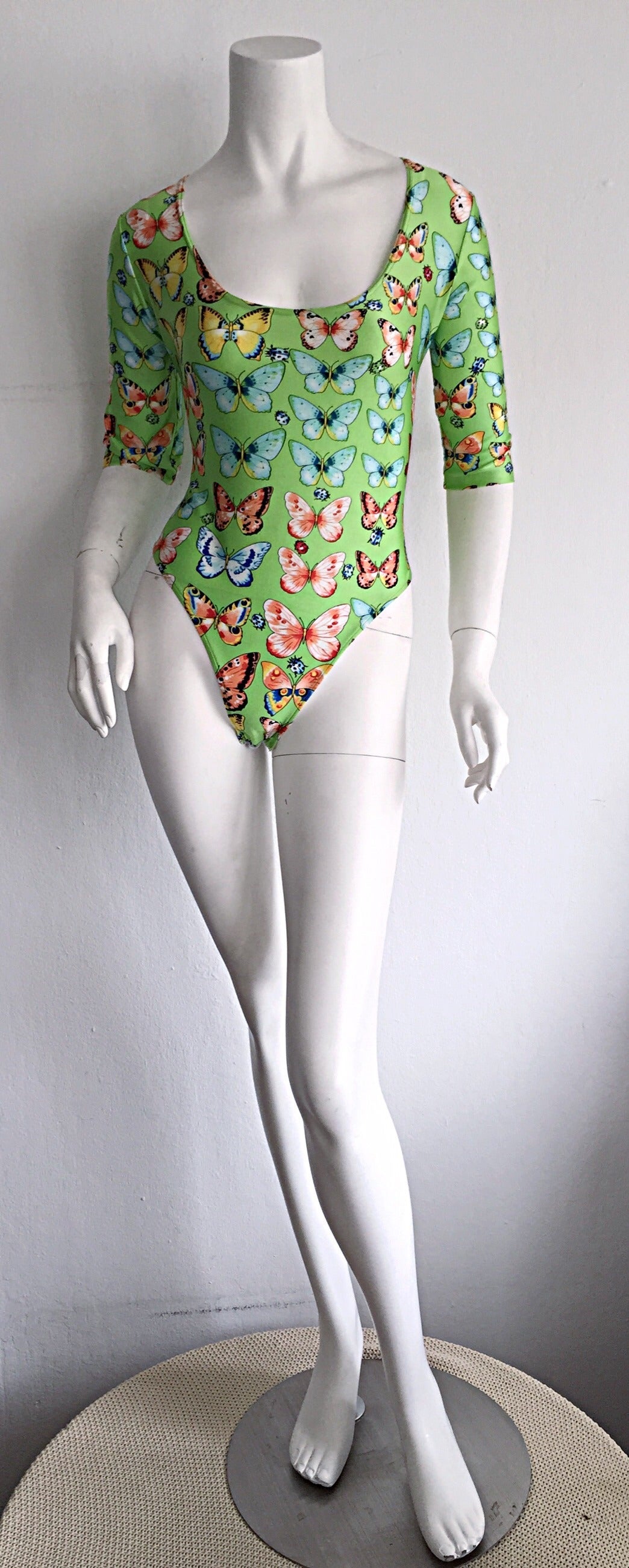 Incredible vintage Kamosho, by Marina Sitbon bodysuit! Iconic butterfly and ladybug print. Made in France. Never worn! Snaps into place, and looks great tucked into shorts, jeans, or a skirt! In great (never worn) condition. Made in France.