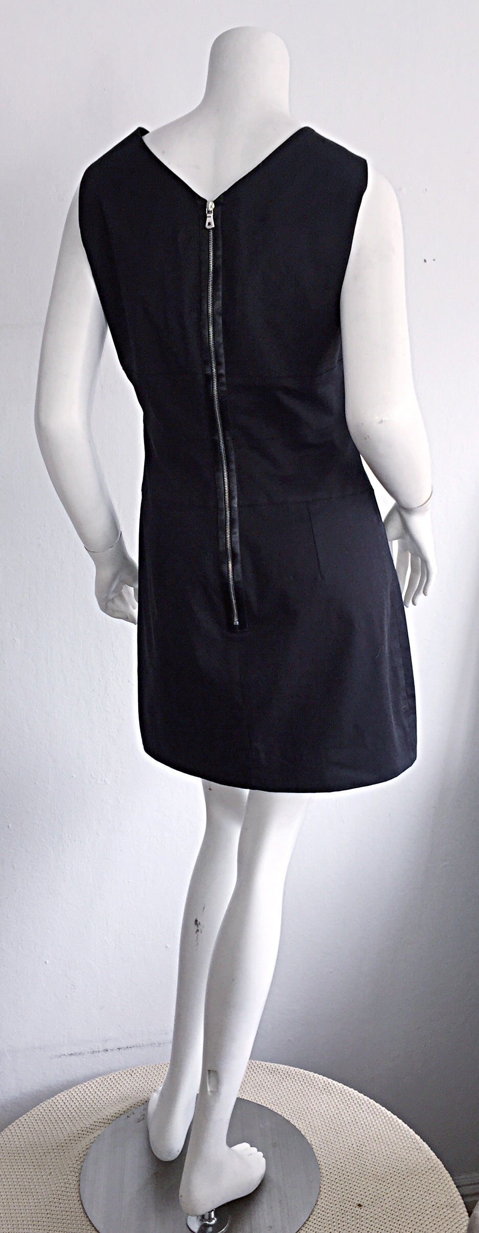 The PERFECT little black dress! 1990s Dolce & Gabbana cotton stretch dress, with exposed silver metal zipper detail on back. Figure flattering fit. This will most definitely be your new 'go-to' LBD (little black dress)! Easily transitions from day