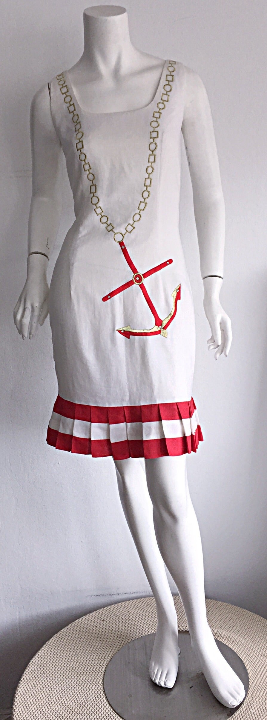 Amazing vintage 1990s nautical dress! Fully lined fine linen, with gold silk thread printed to look like a chain necklace, with red embroidered anchor, encrusted with three rhinestones. Pleated red and white hem. Easily transitions from day to