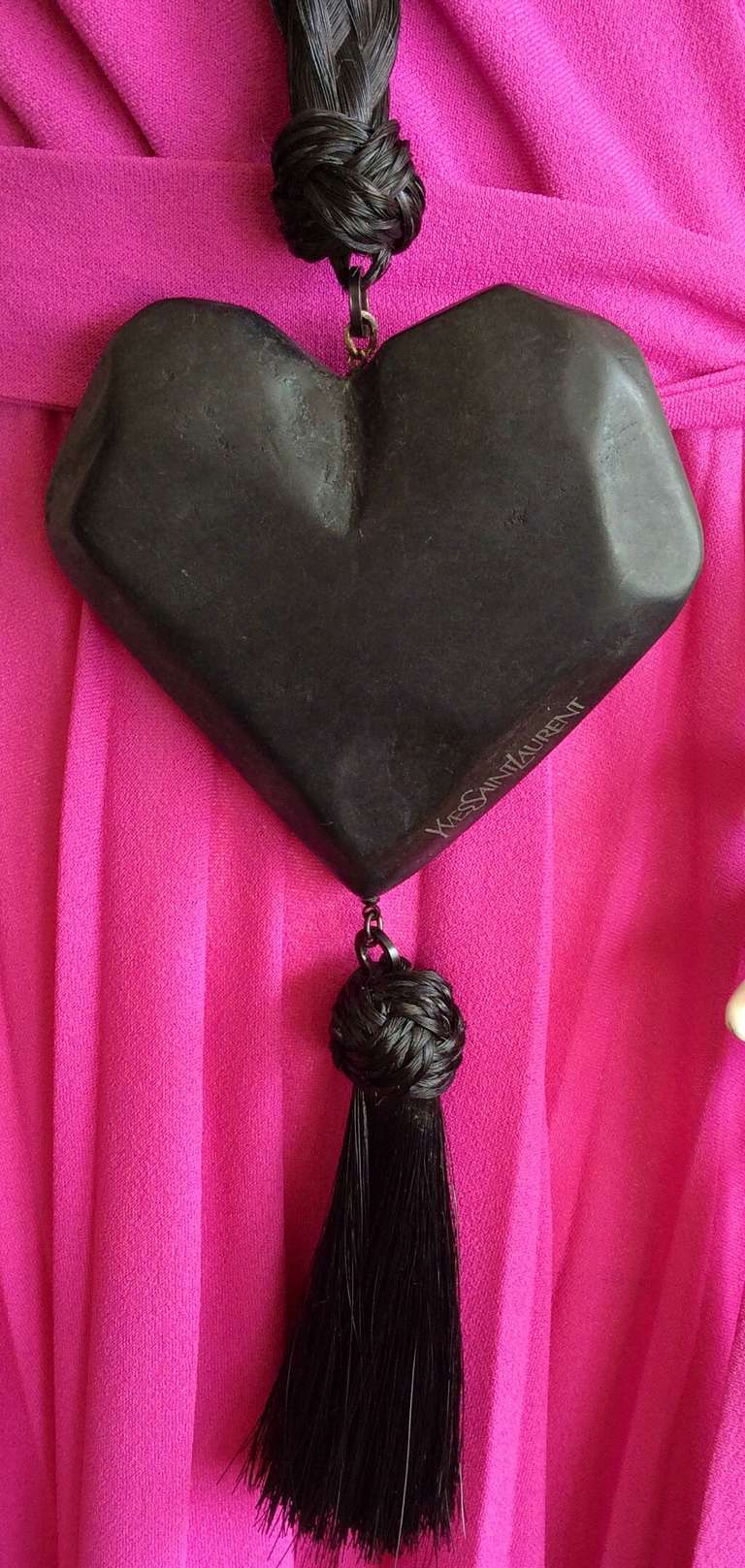 Stunning vintage YSL necklace with black carved wooden heart, and black braided horsehair. Horsehair tassel on bottom of heart. From the Russian collection.